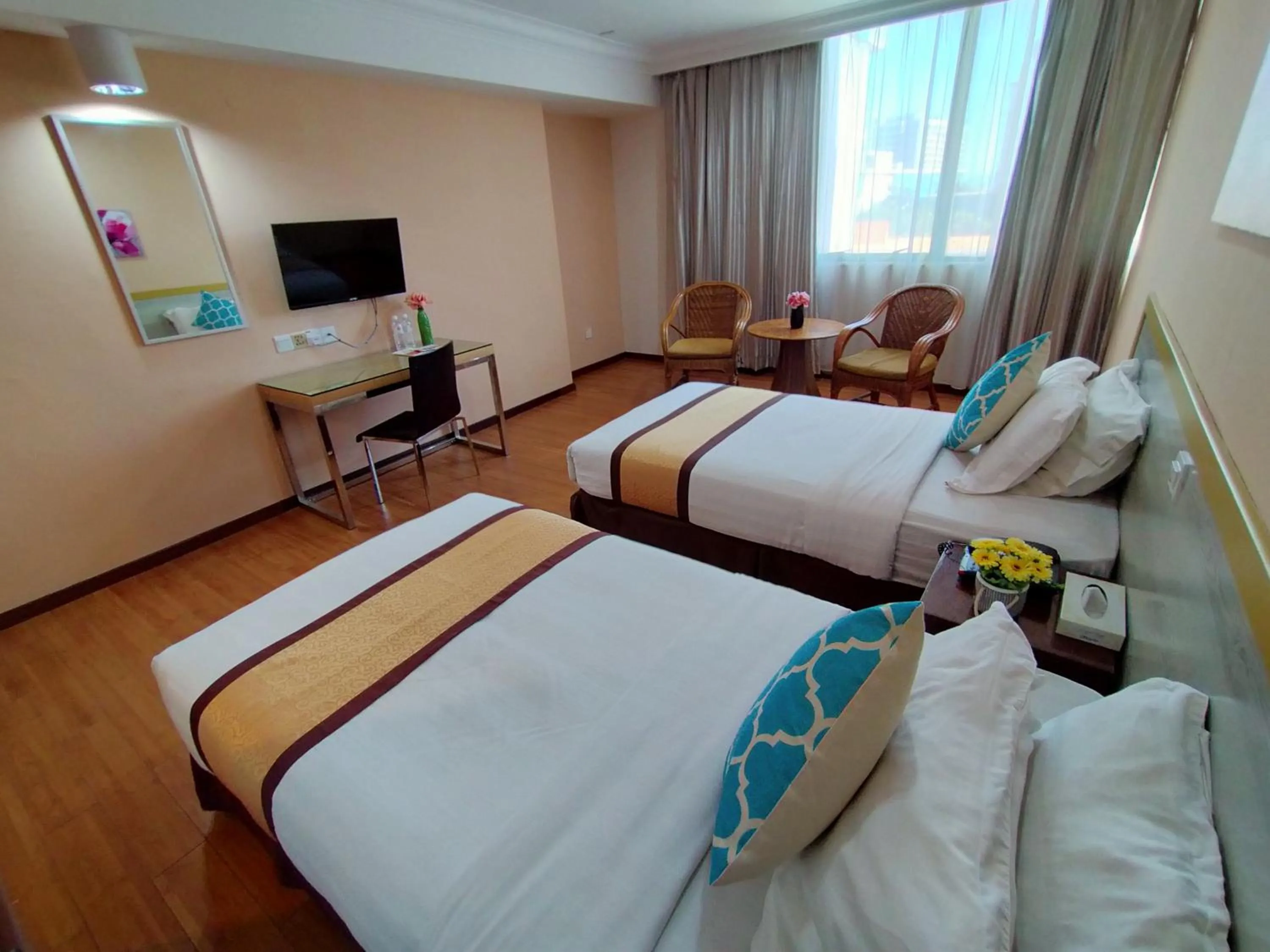 Bed in TD Plaza Hotel