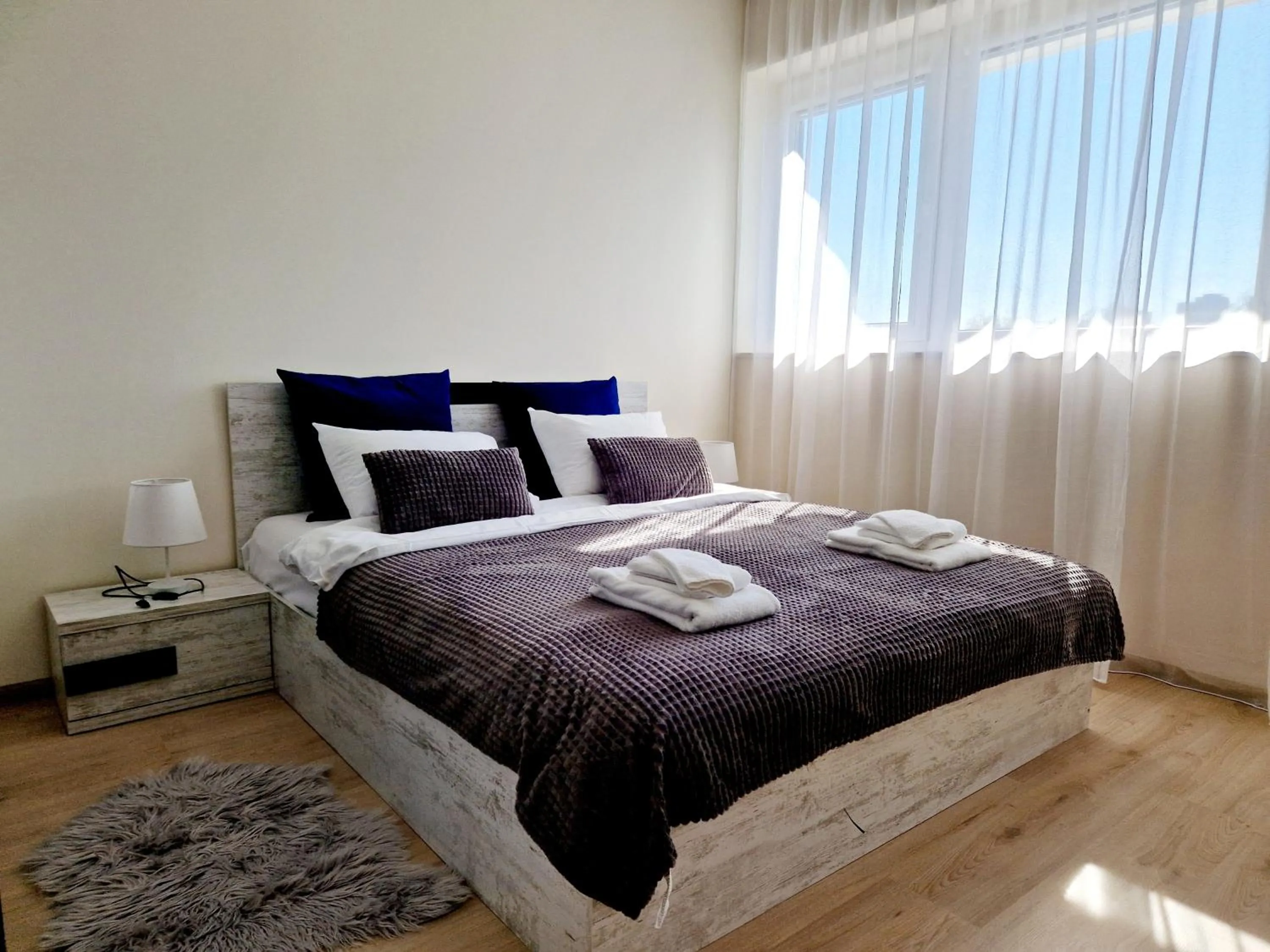 Bed in PAPAYA APARTMENTS