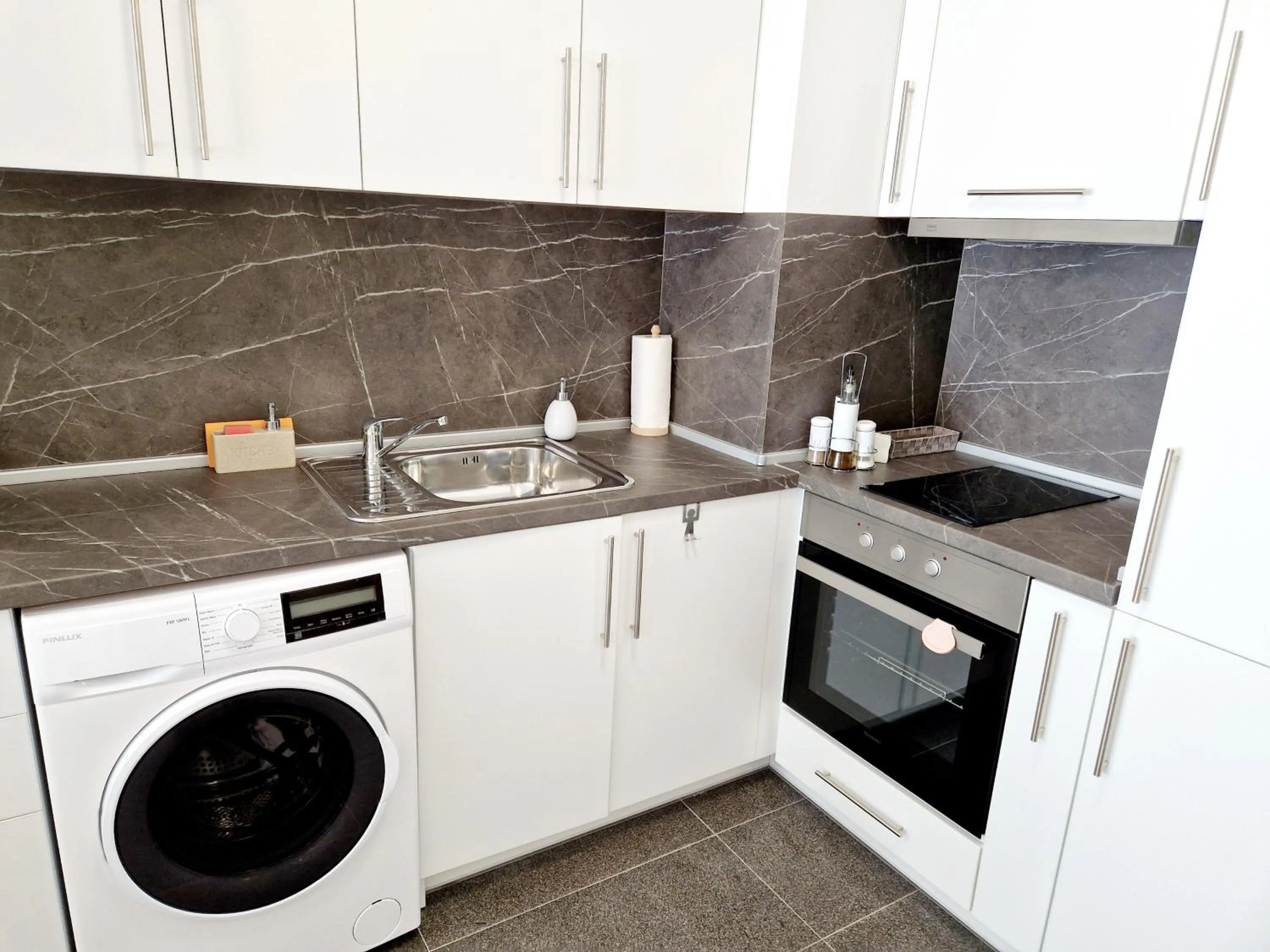 Kitchen or kitchenette in PAPAYA APARTMENTS