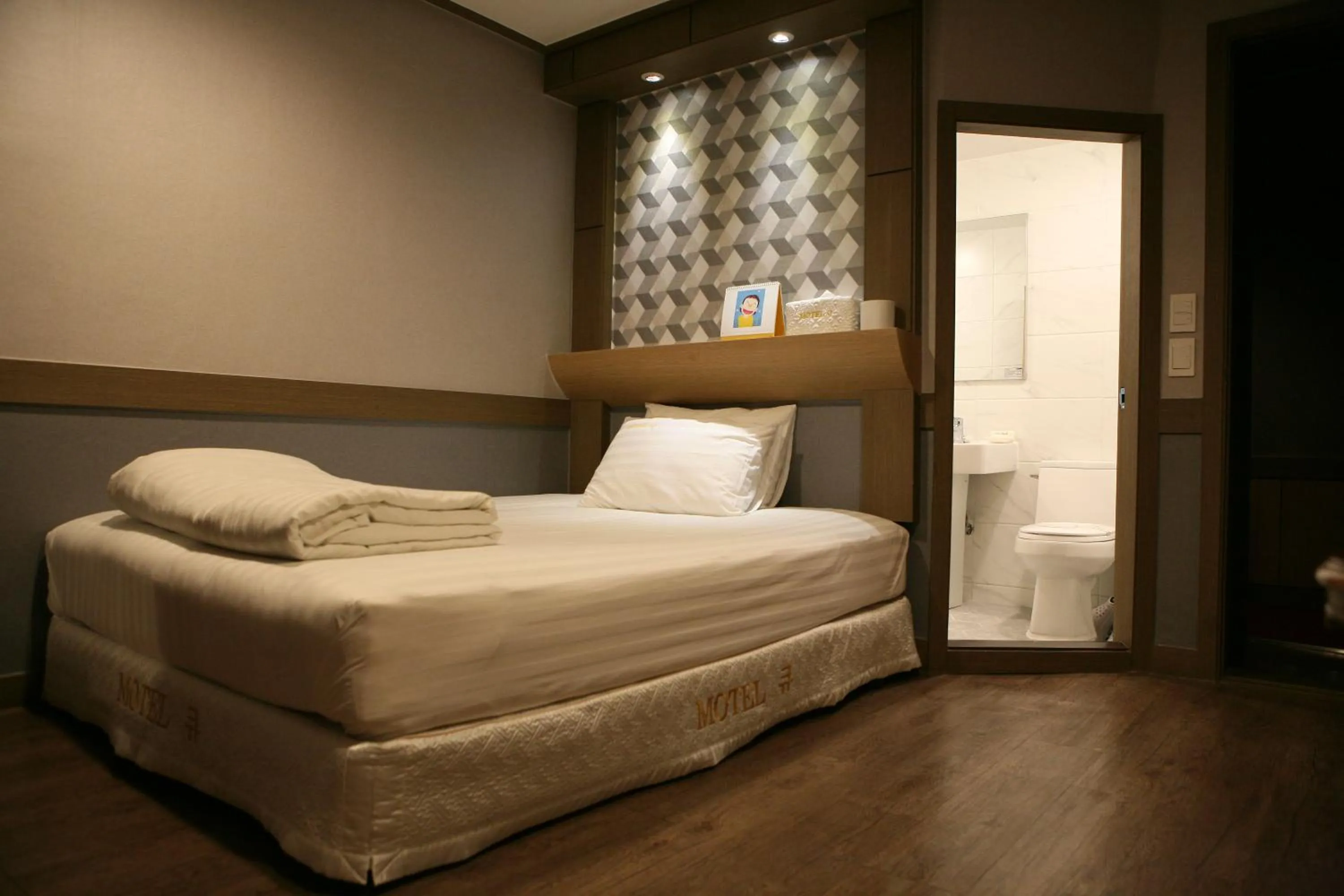 Bed in Hotel Q Chuncheon
