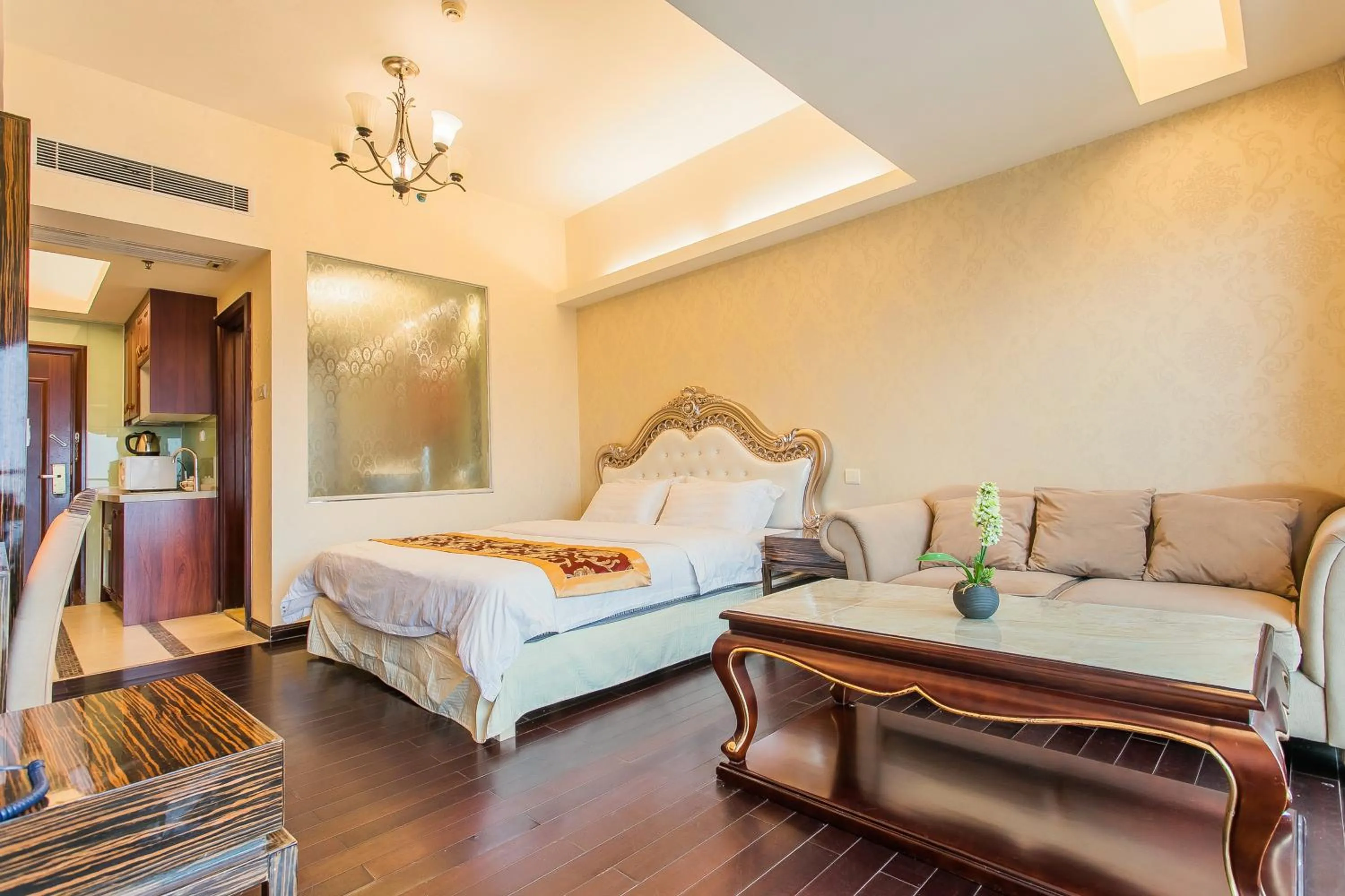 Bed in Grand Continental Apartment