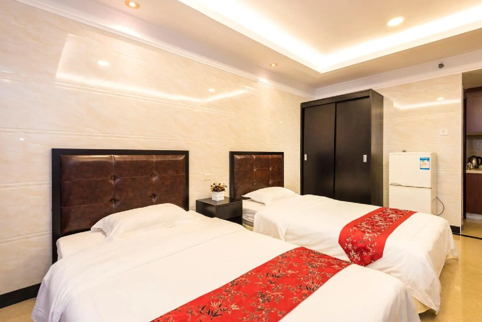 Bed in Grand Continental Apartment