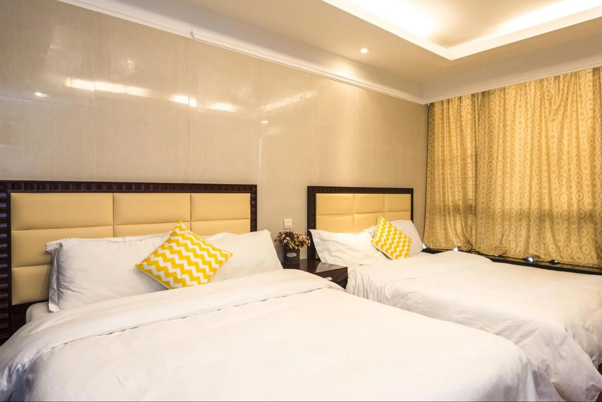 Bed in Grand Continental Apartment