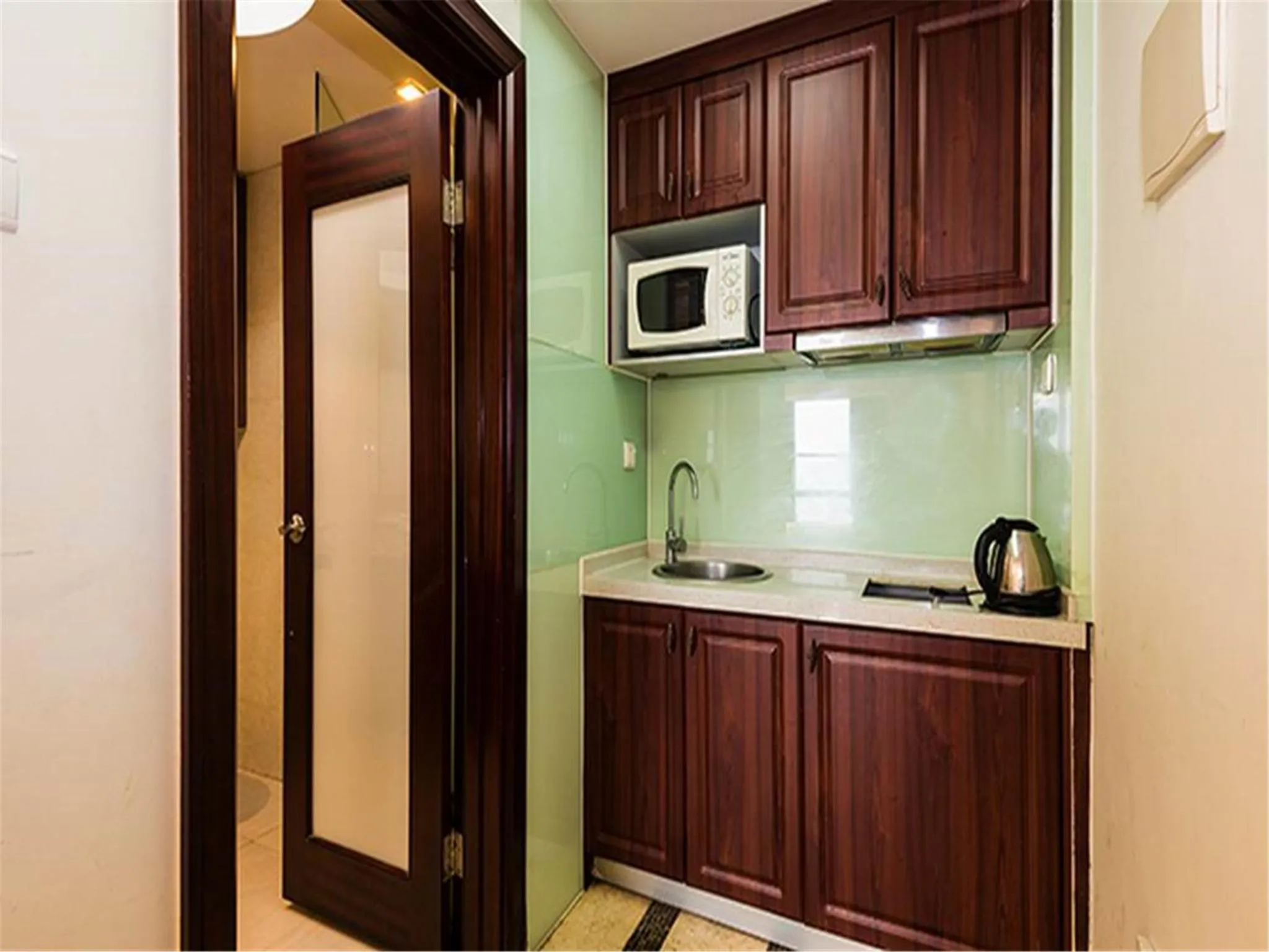 Kitchen or kitchenette in Grand Continental Apartment