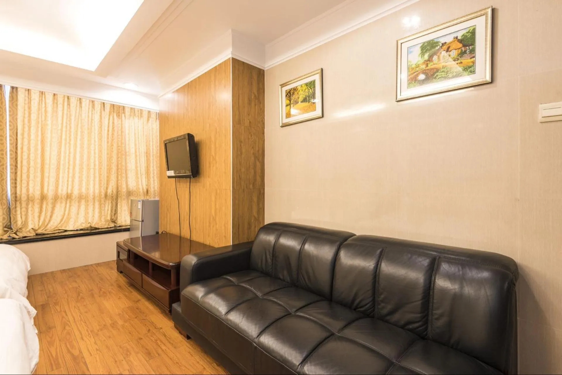 Bed in Grand Continental Apartment