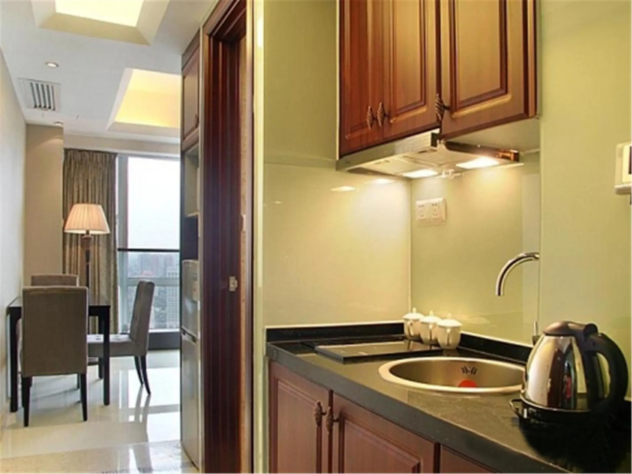 Kitchen or kitchenette in Grand Continental Apartment