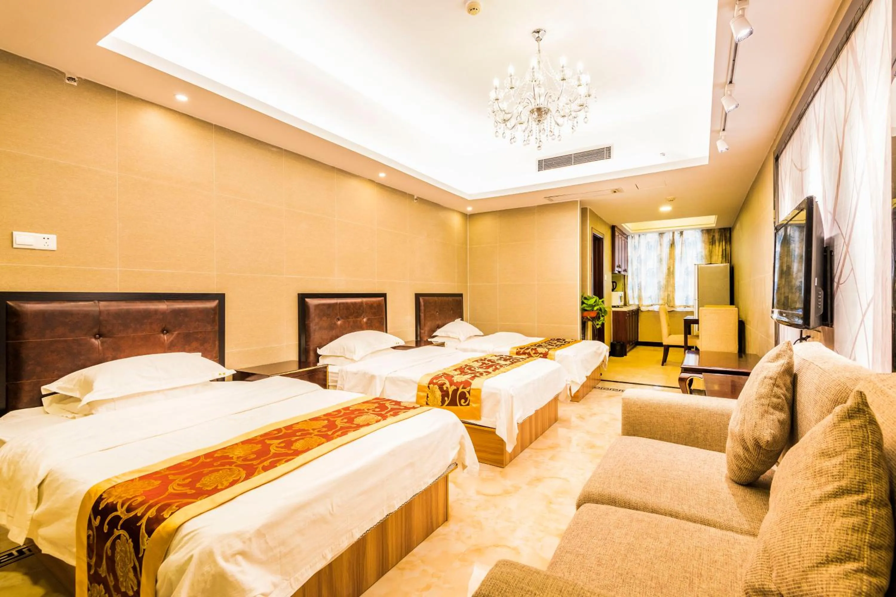 Bed in Grand Continental Apartment