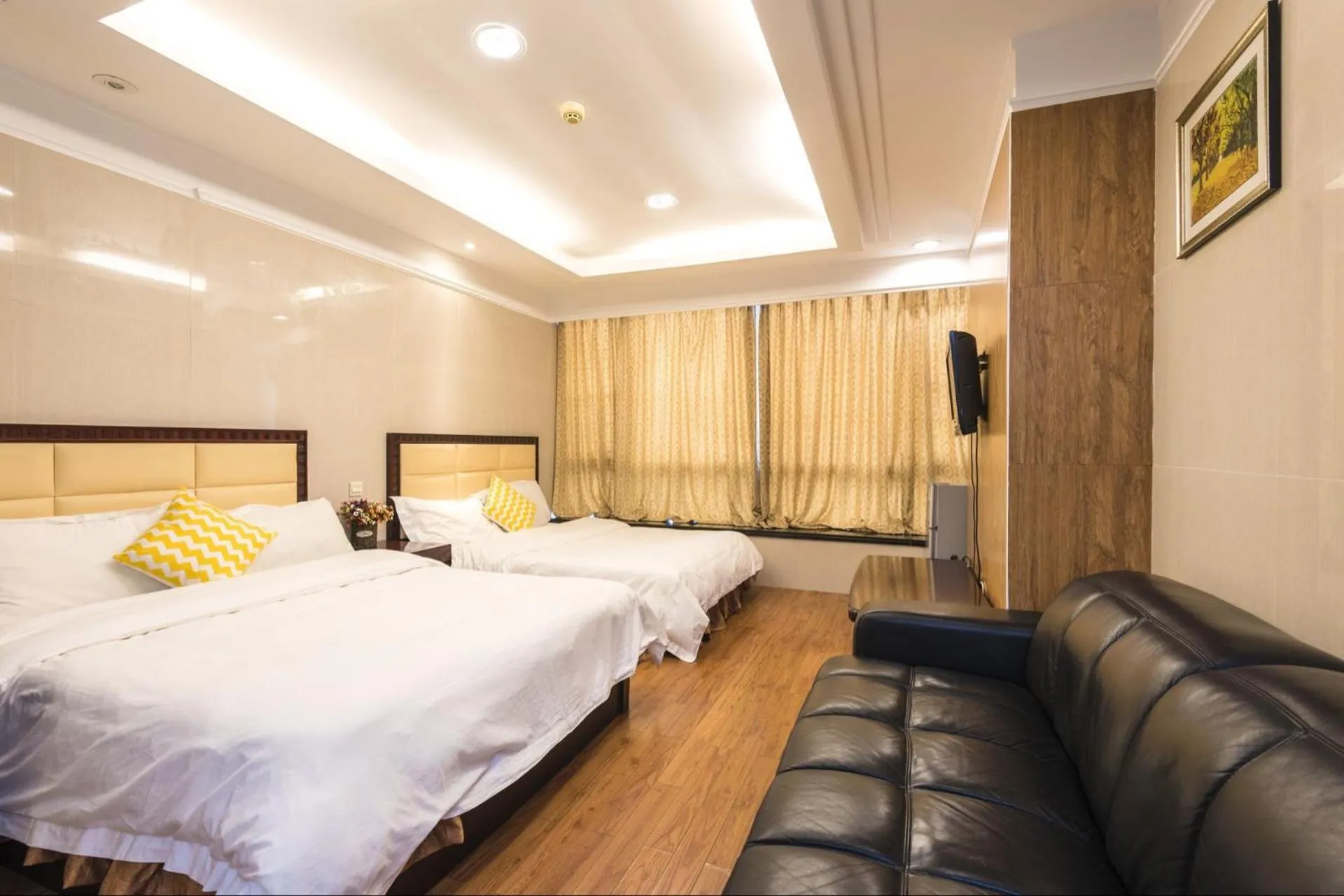 Bed in Grand Continental Apartment