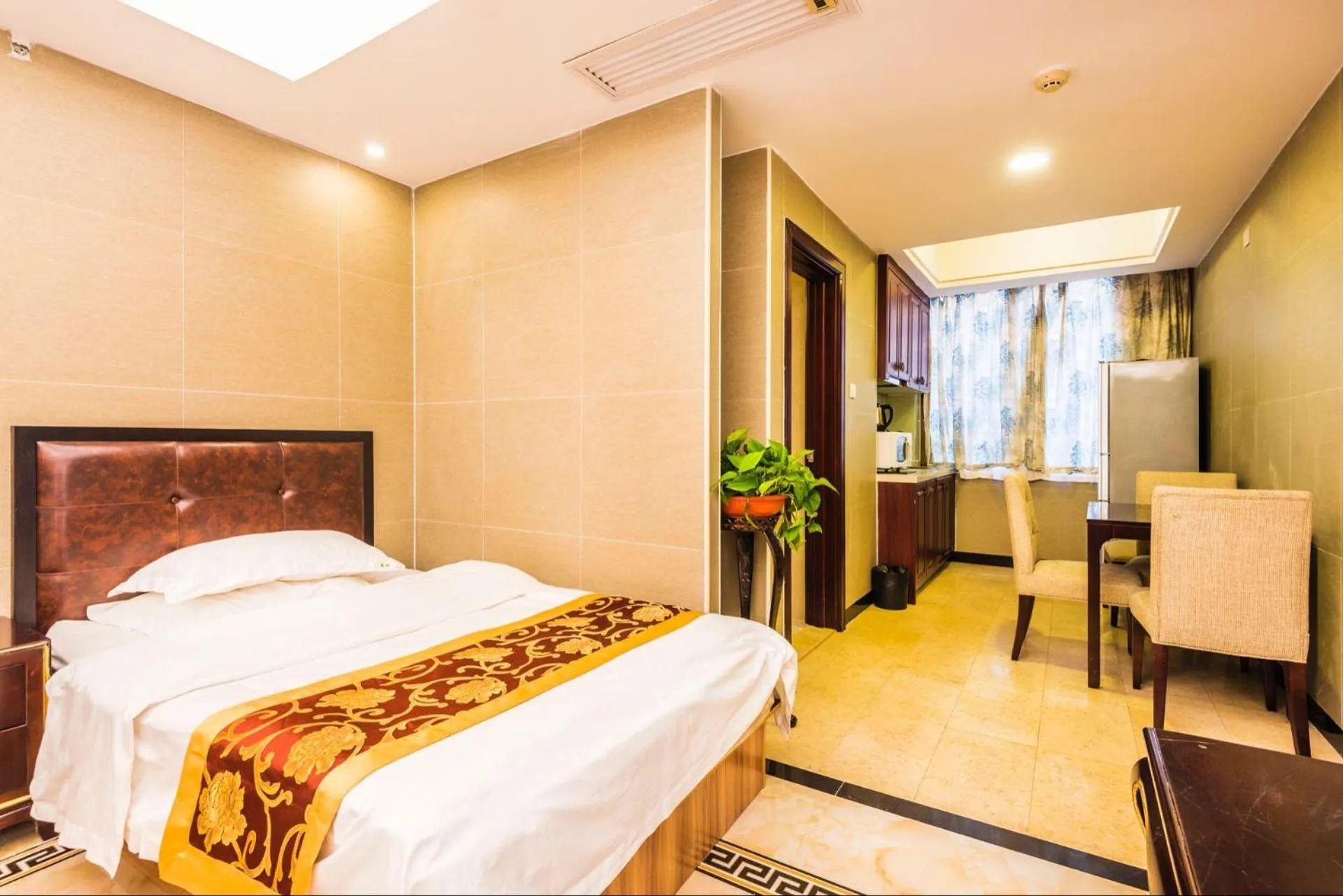 Bed in Grand Continental Apartment