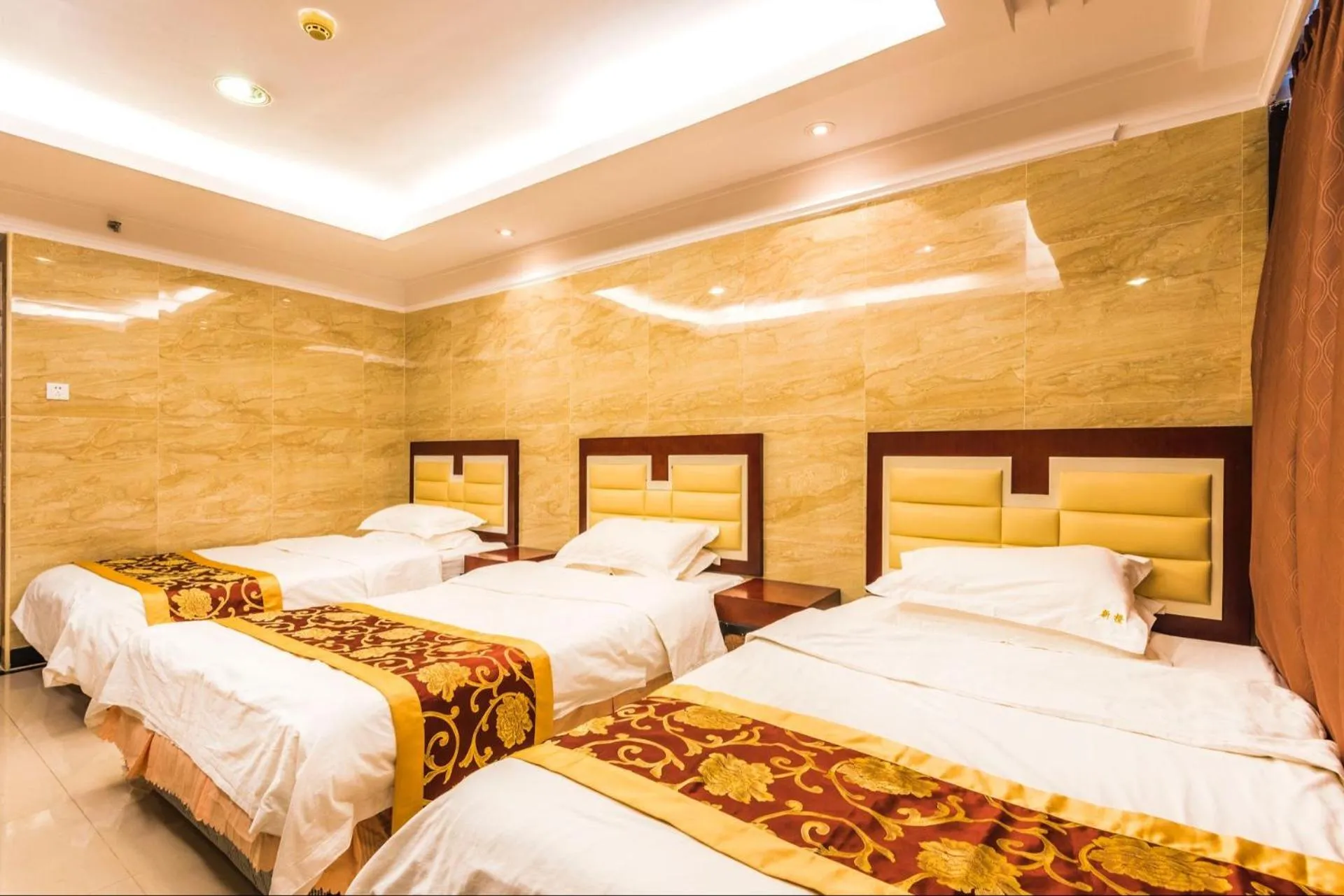 Bed in Grand Continental Apartment