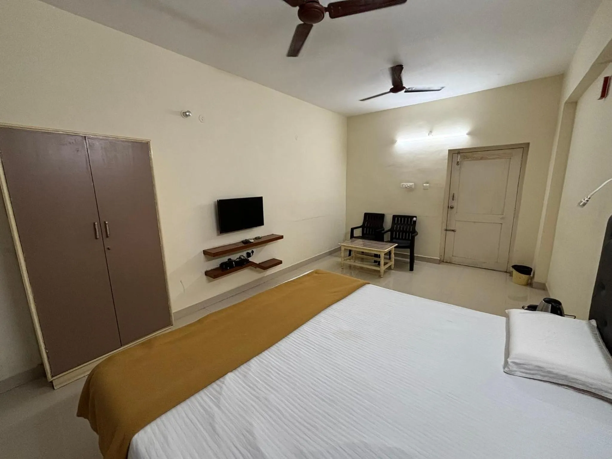 Bed in Srinivasa Hotel