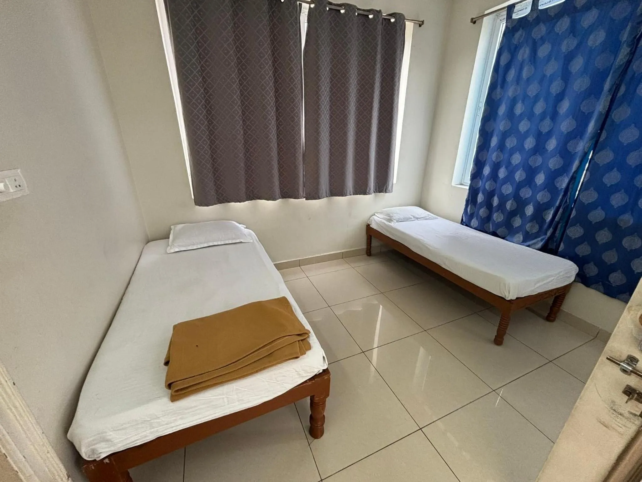 Bed in Srinivasa Hotel