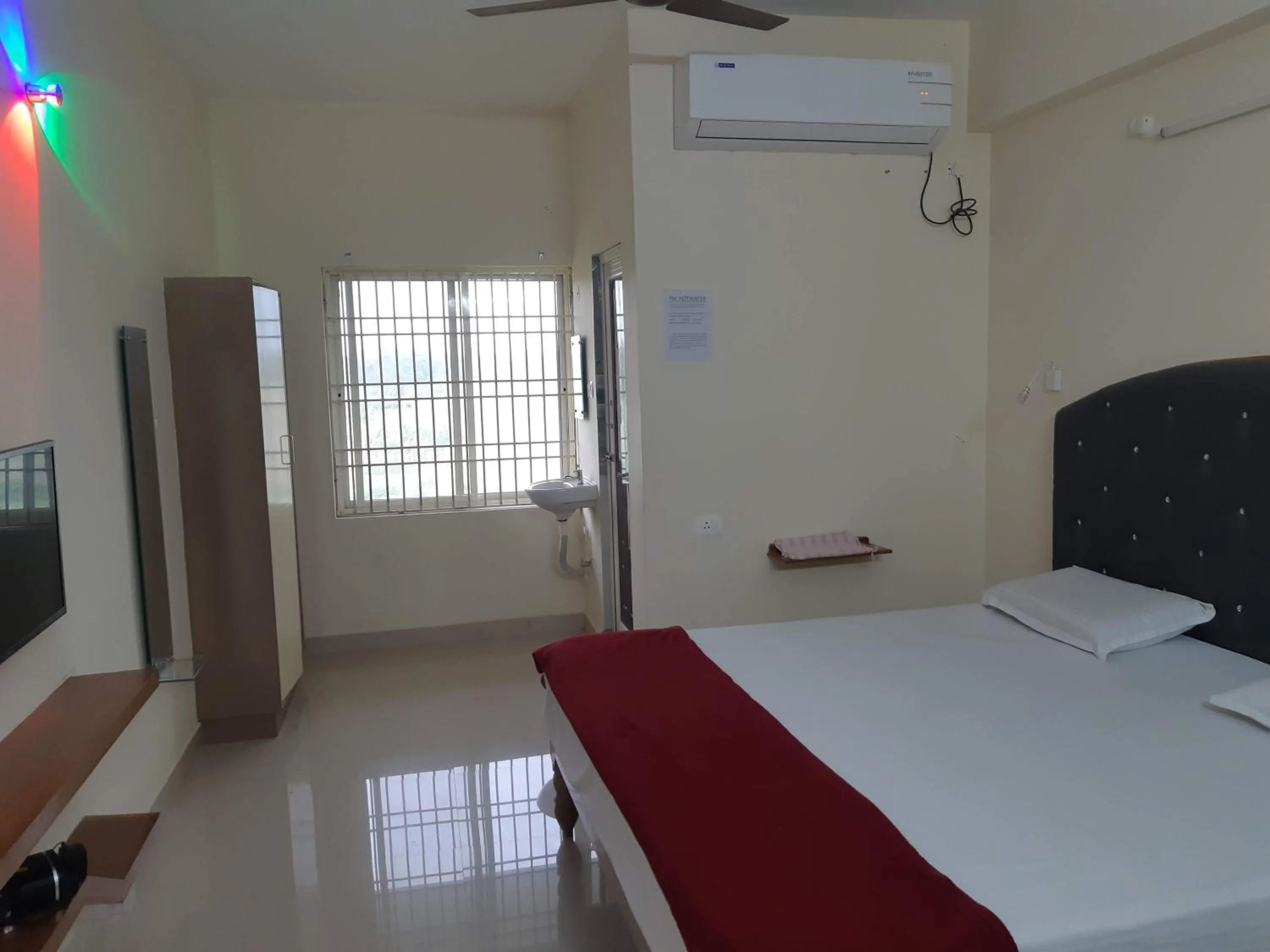 Bed in Srinivasa Hotel