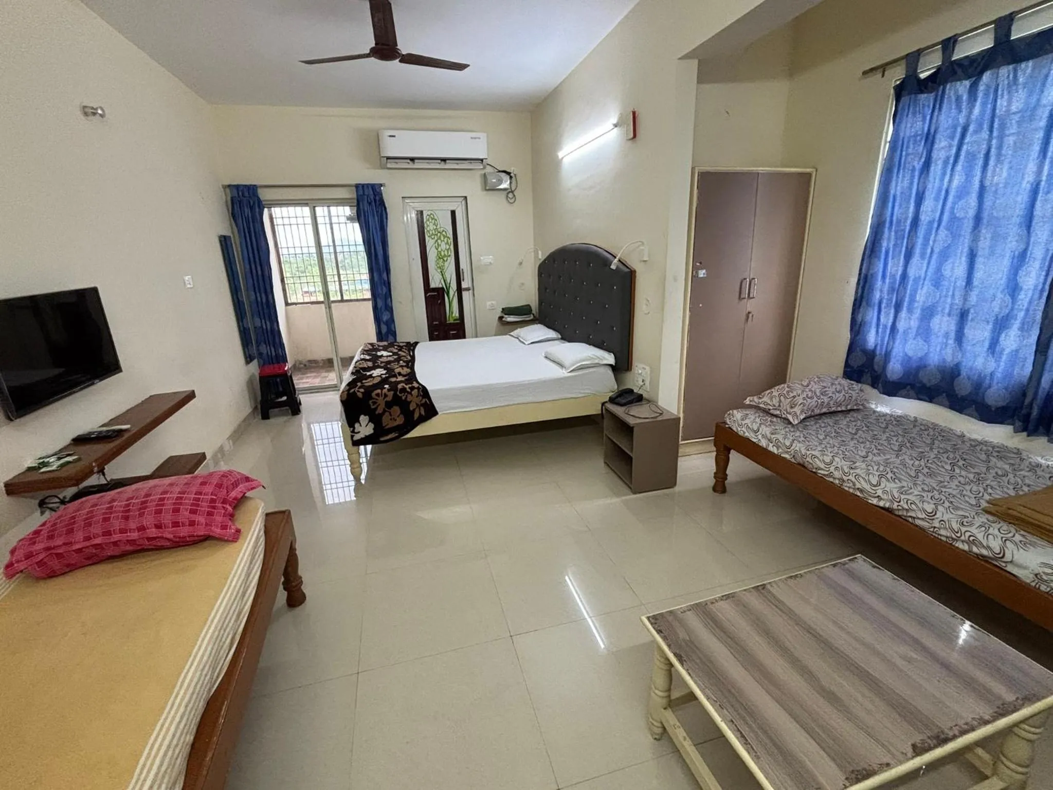 Bed in Srinivasa Hotel