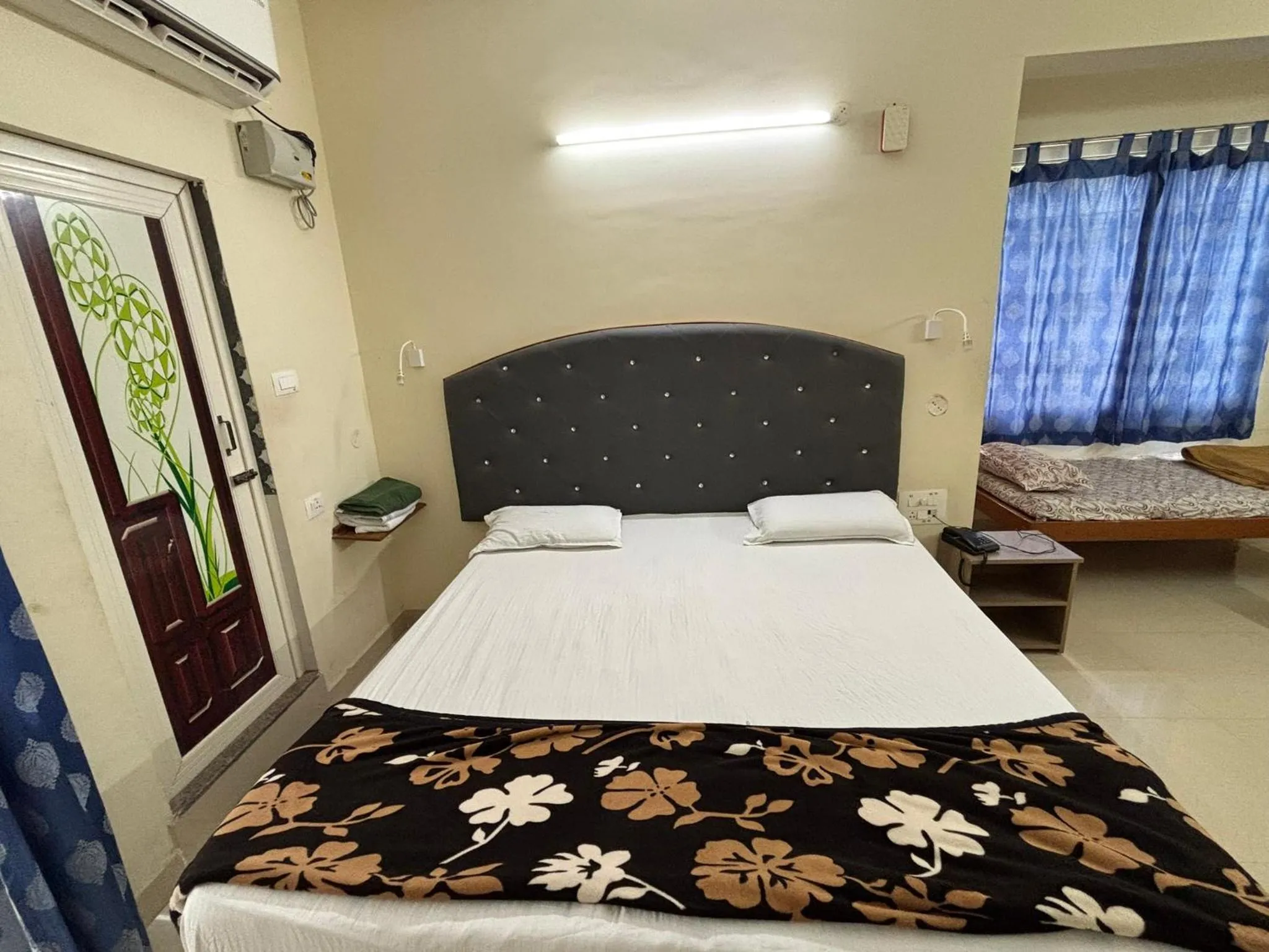 Bed in Srinivasa Hotel