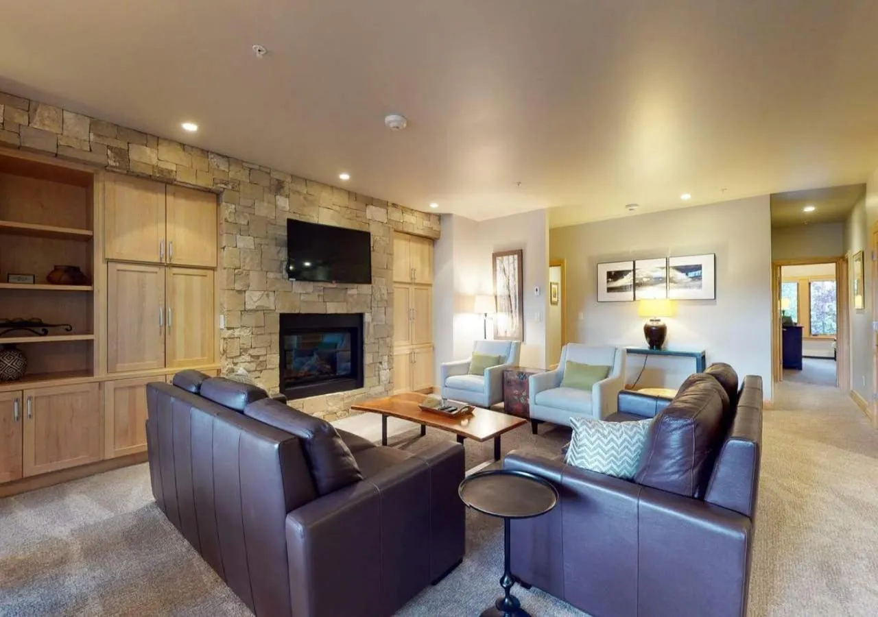 Living room in Lion Square Lodge Condos by TO