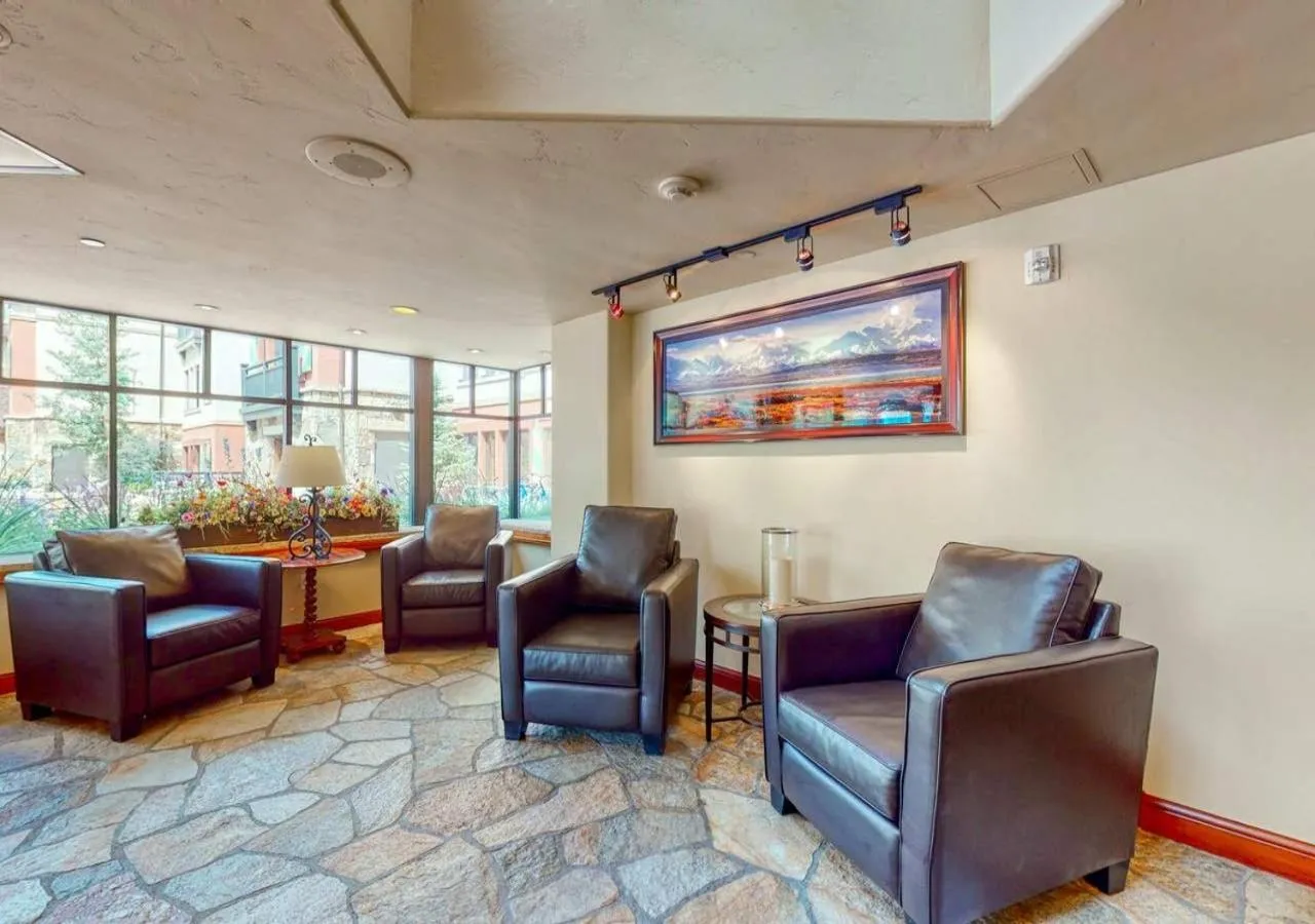 Living room in Lion Square Lodge Condos by TO