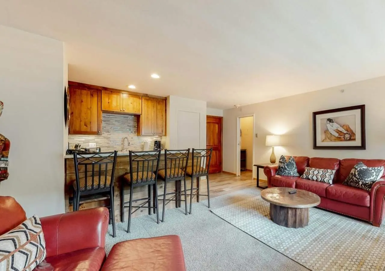 Living room in Lion Square Lodge Condos by TO