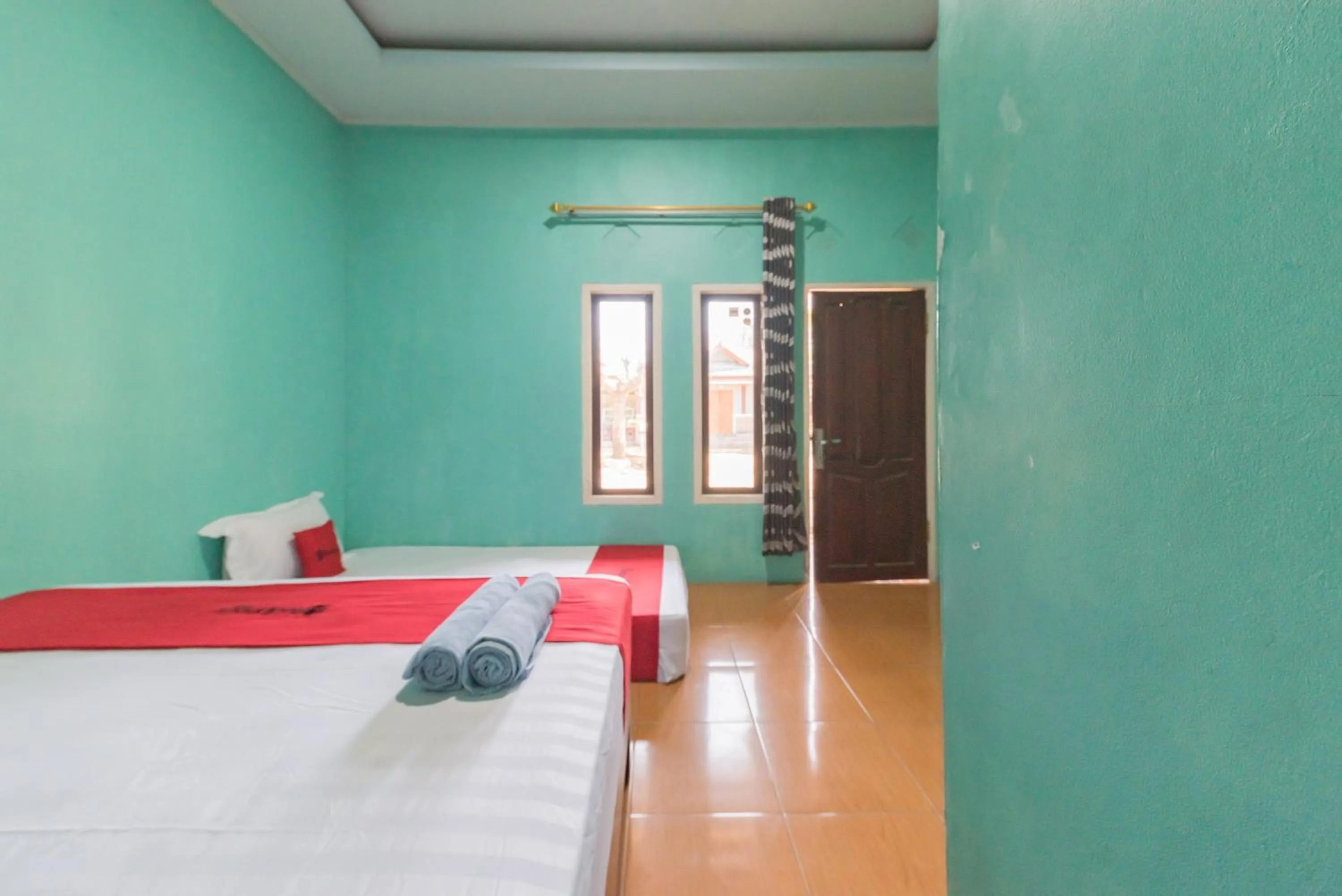 Bed in RedDoorz near Pantai Ujung Genteng