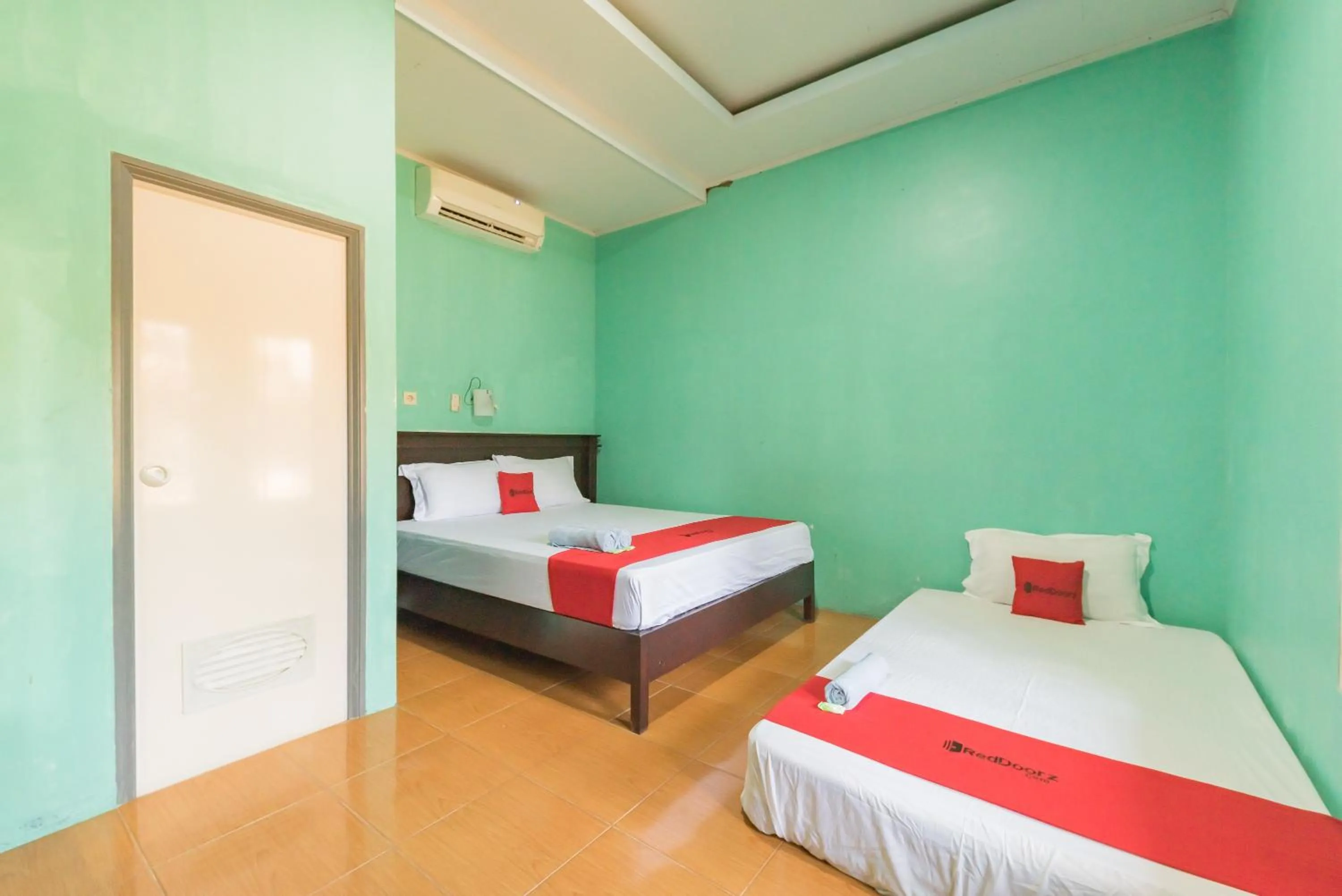 Bed in RedDoorz near Pantai Ujung Genteng