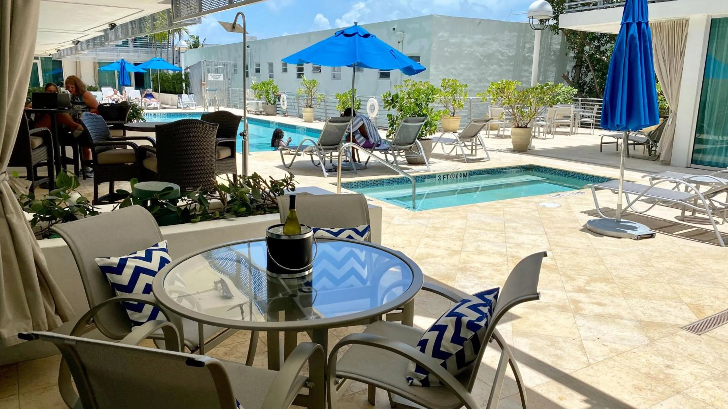 Patio in Boutique Suites 3 min walk to beach