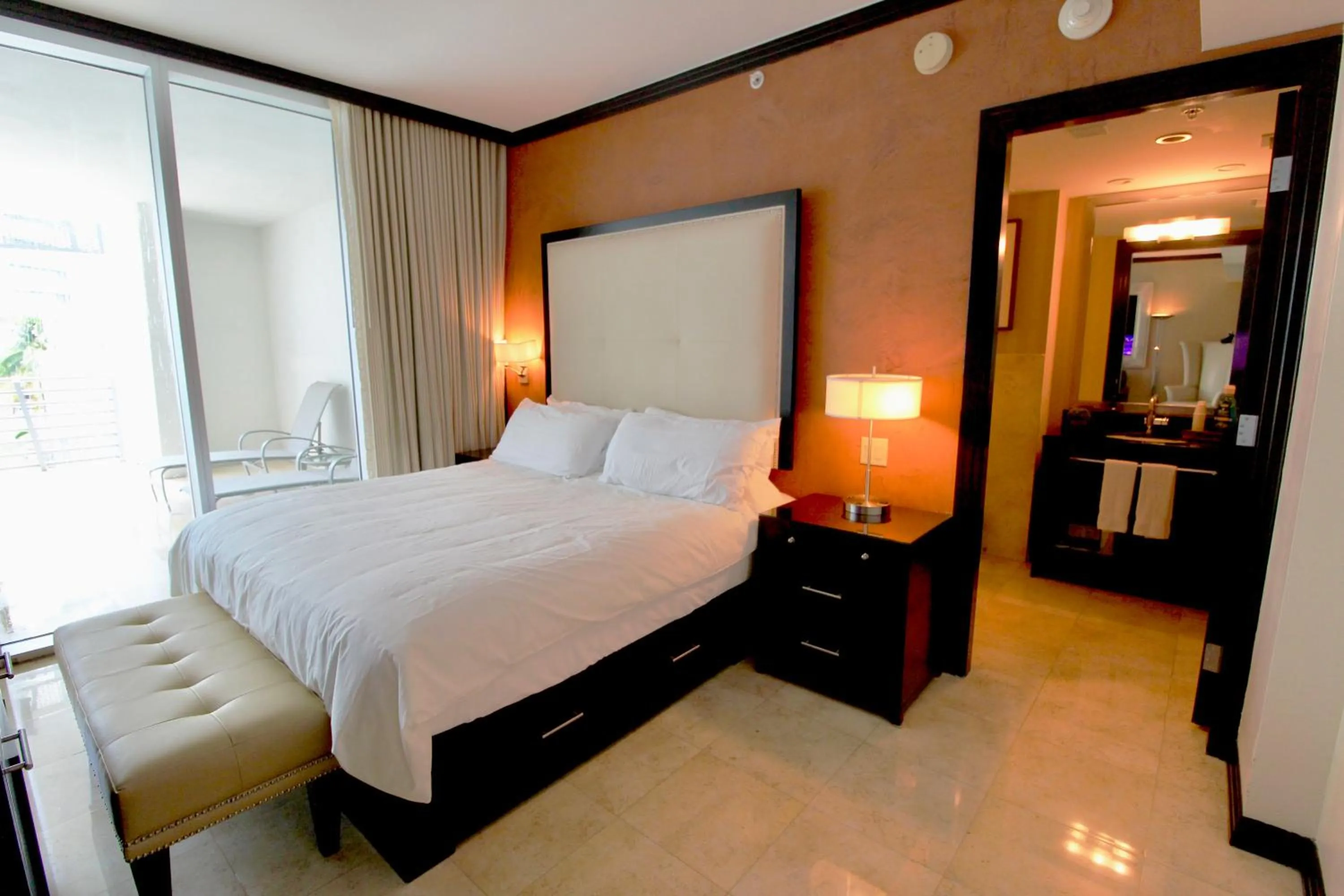 Photo of the whole room, Bed in Boutique Suites 3 min walk to beach