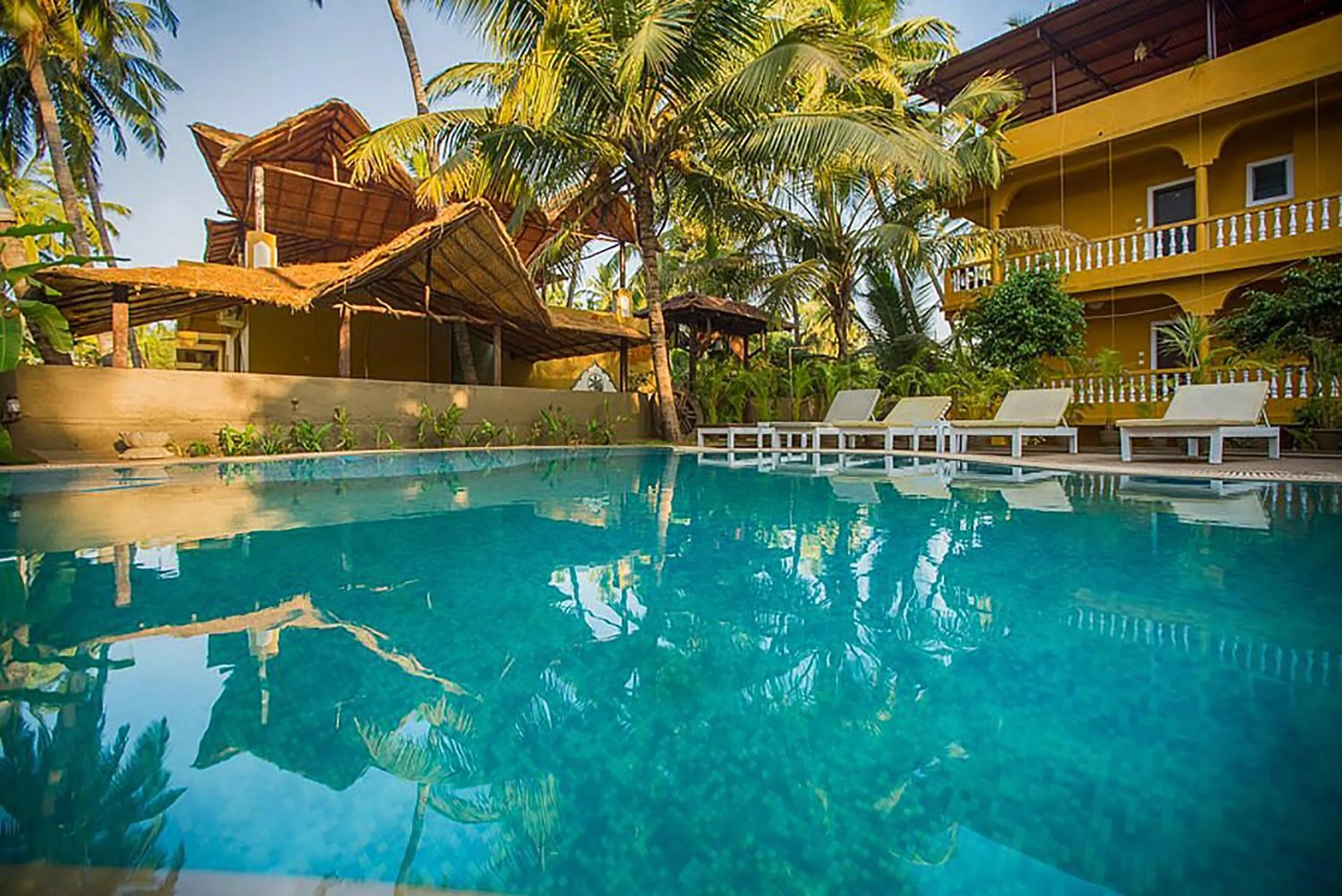 Swimming pool in juSTa Morjim Beach Resort Goa - 80 Steps from Morjim Beach