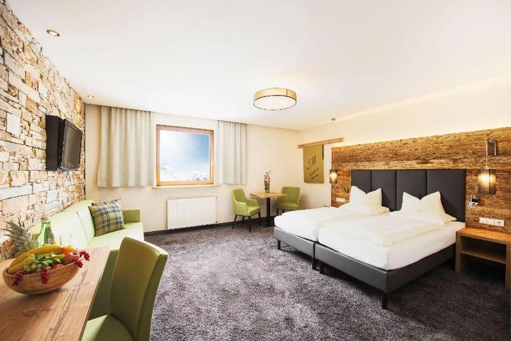 Photo of the whole room, Bed in Mooshaus Winterresort