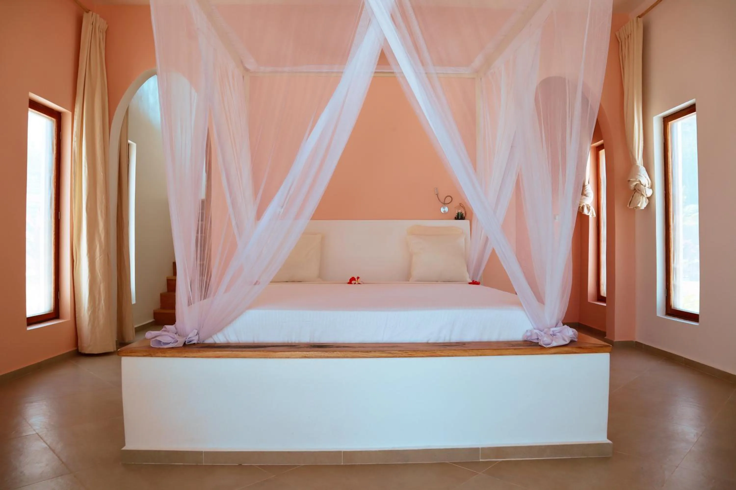 Bed in Kijani Beach Villas