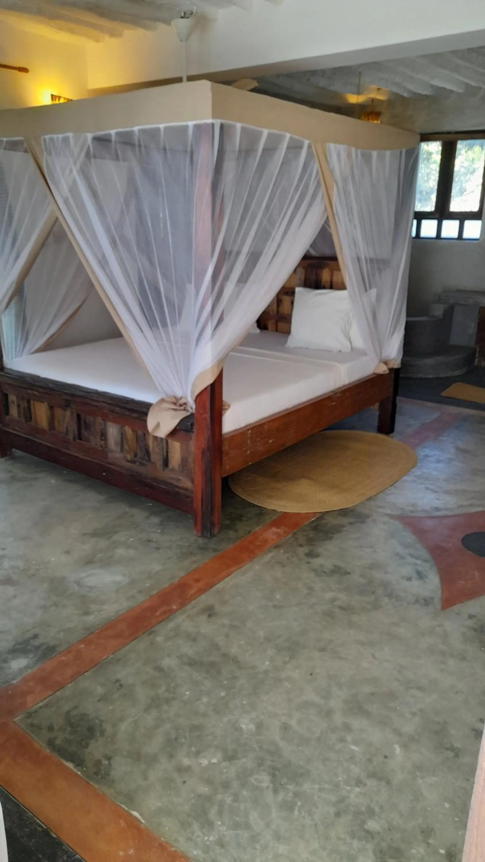 Bed in Kijani Beach Villas
