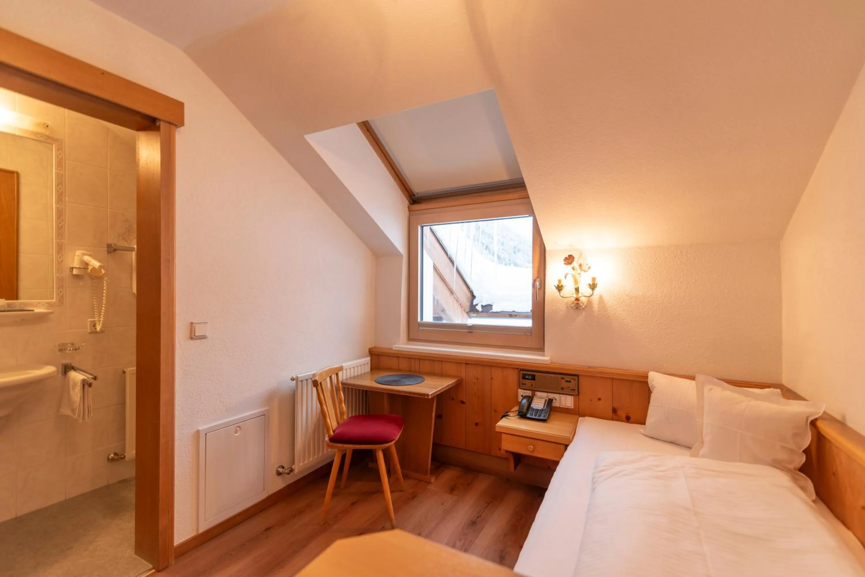 Bed in Hotel Garni Helvetia