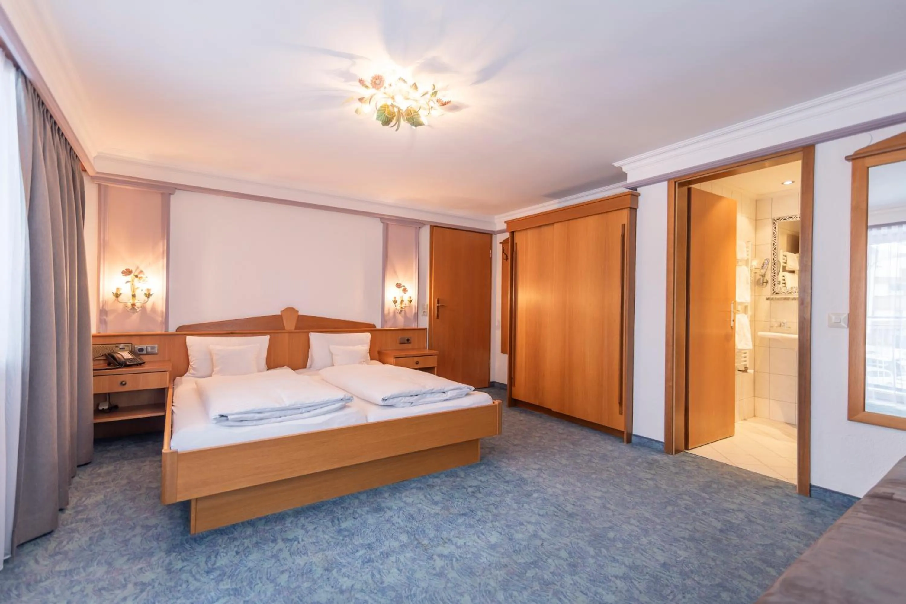 Bed in Hotel Garni Helvetia