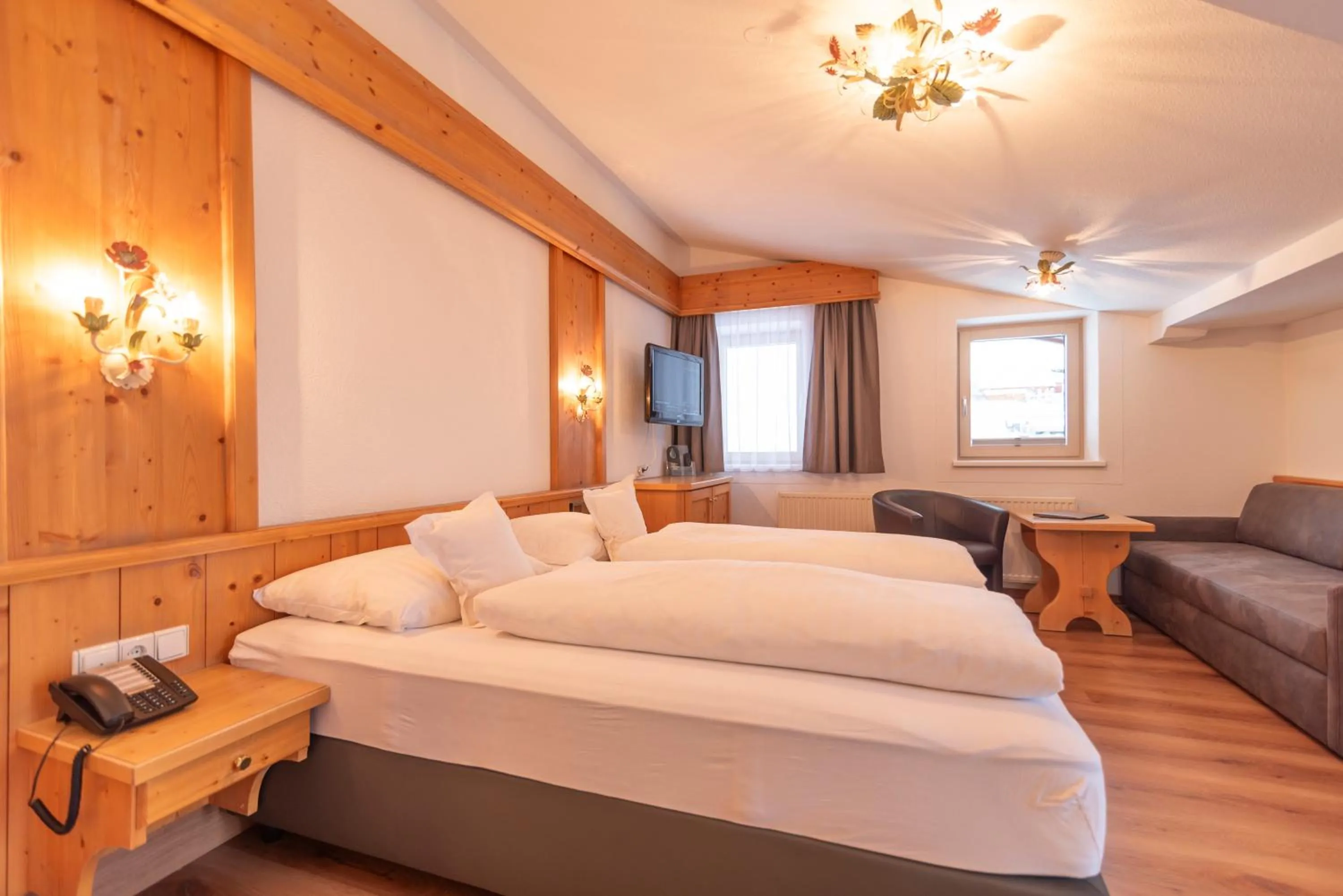 Bed in Hotel Garni Helvetia