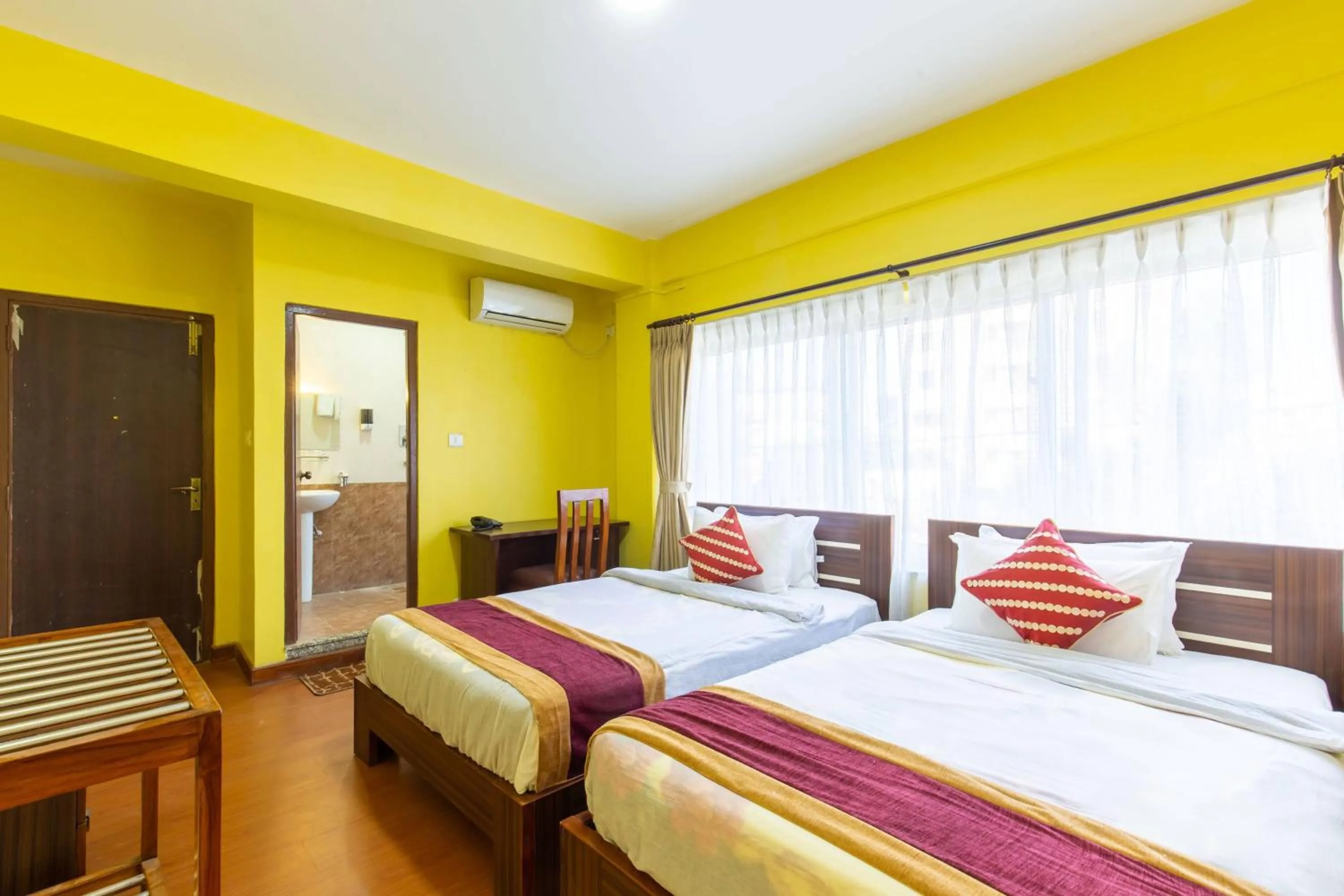 Bed in Deepjyoti Inn