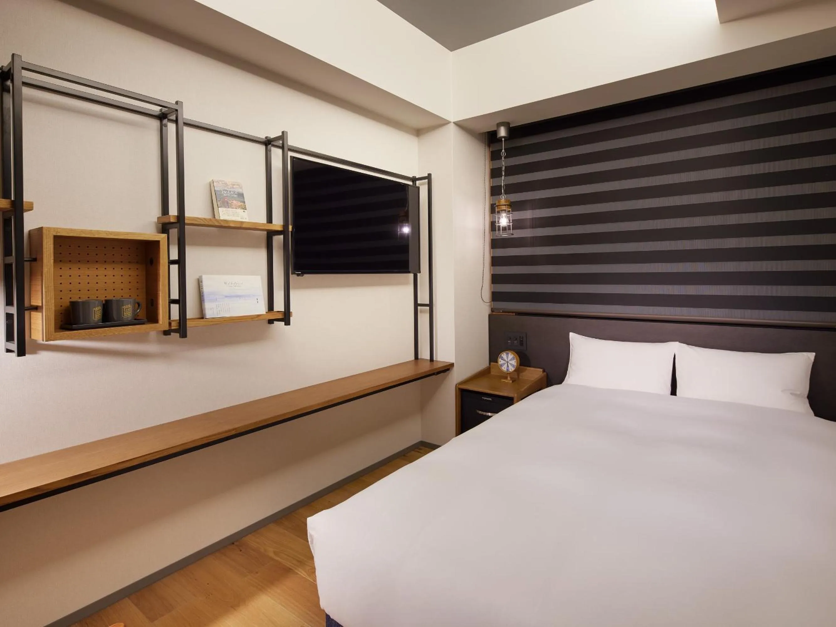 Bed in LAMP LIGHT BOOKS HOTEL fukuoka