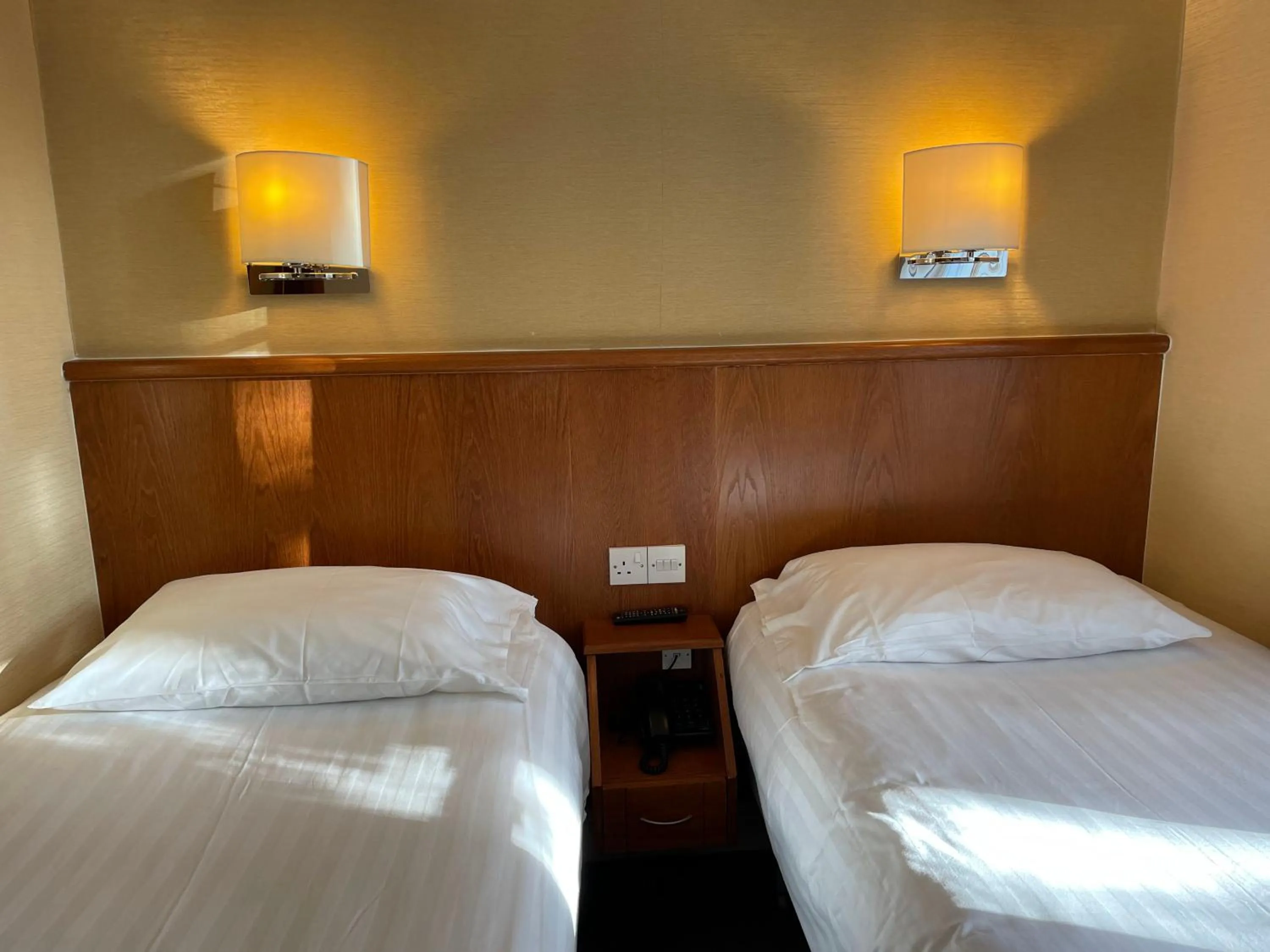 Bed in Orchard Hotel