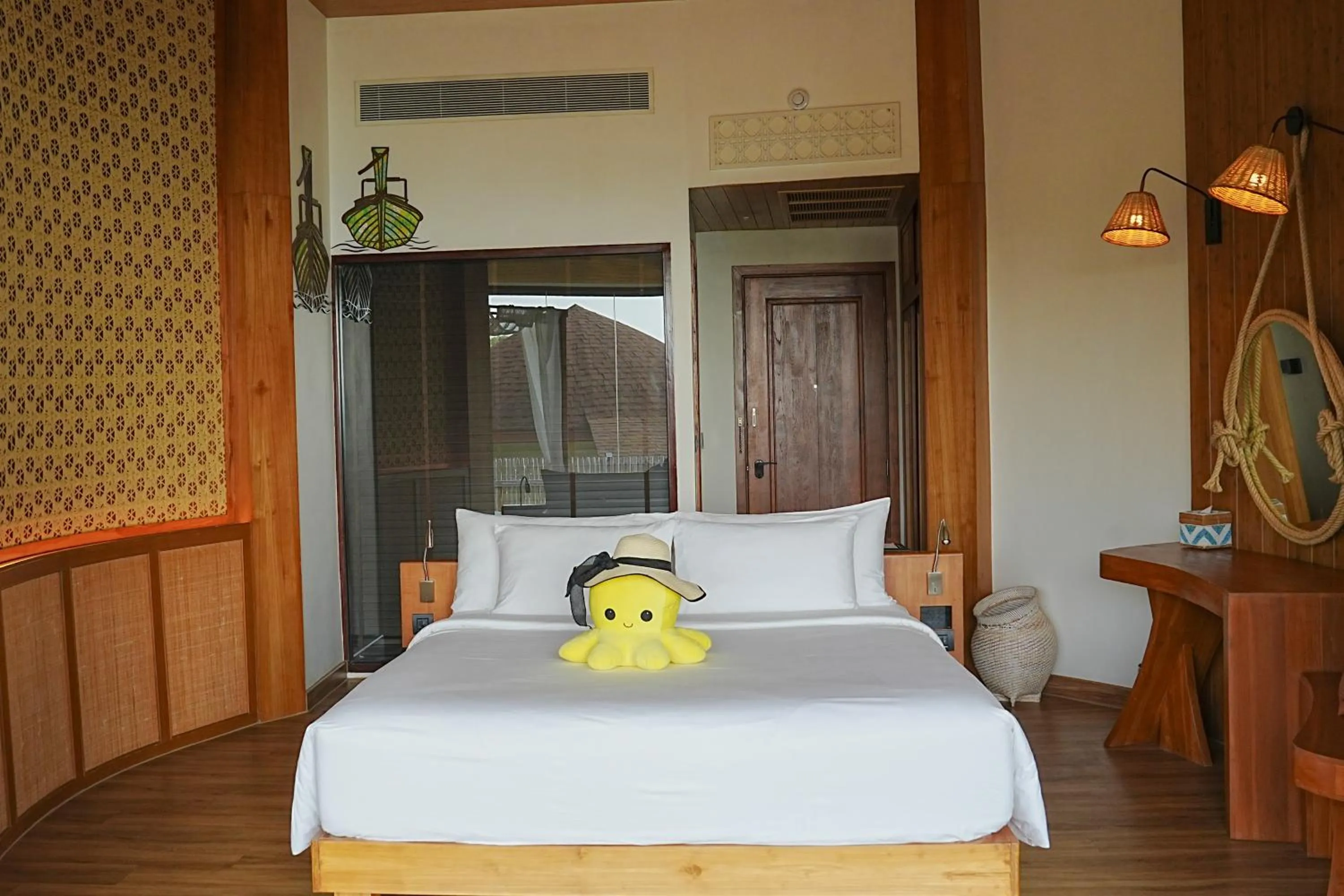 Bed in SINAE Phuket Luxury Hotel