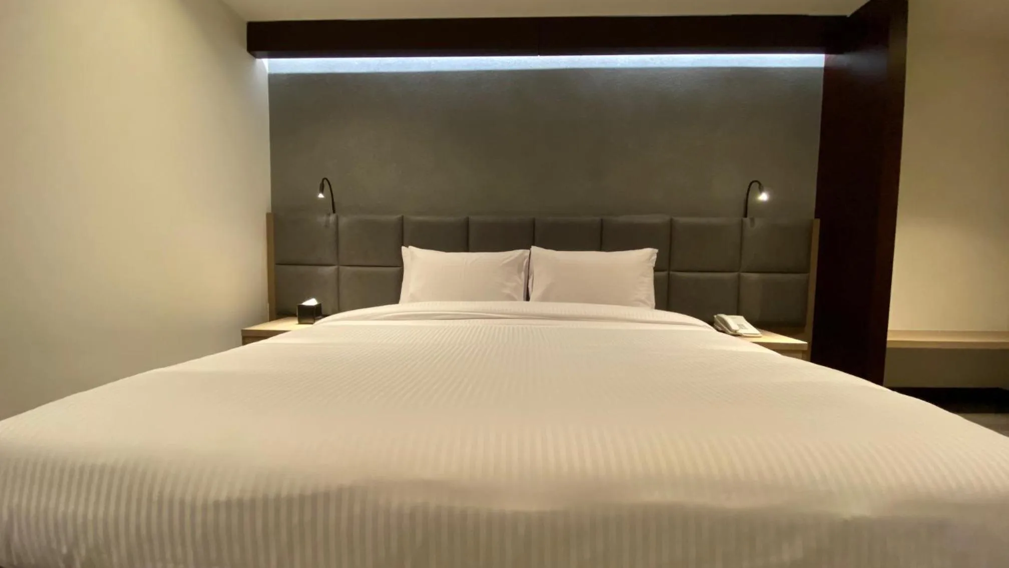 Bed in SITARA HOTEL APARTMENT