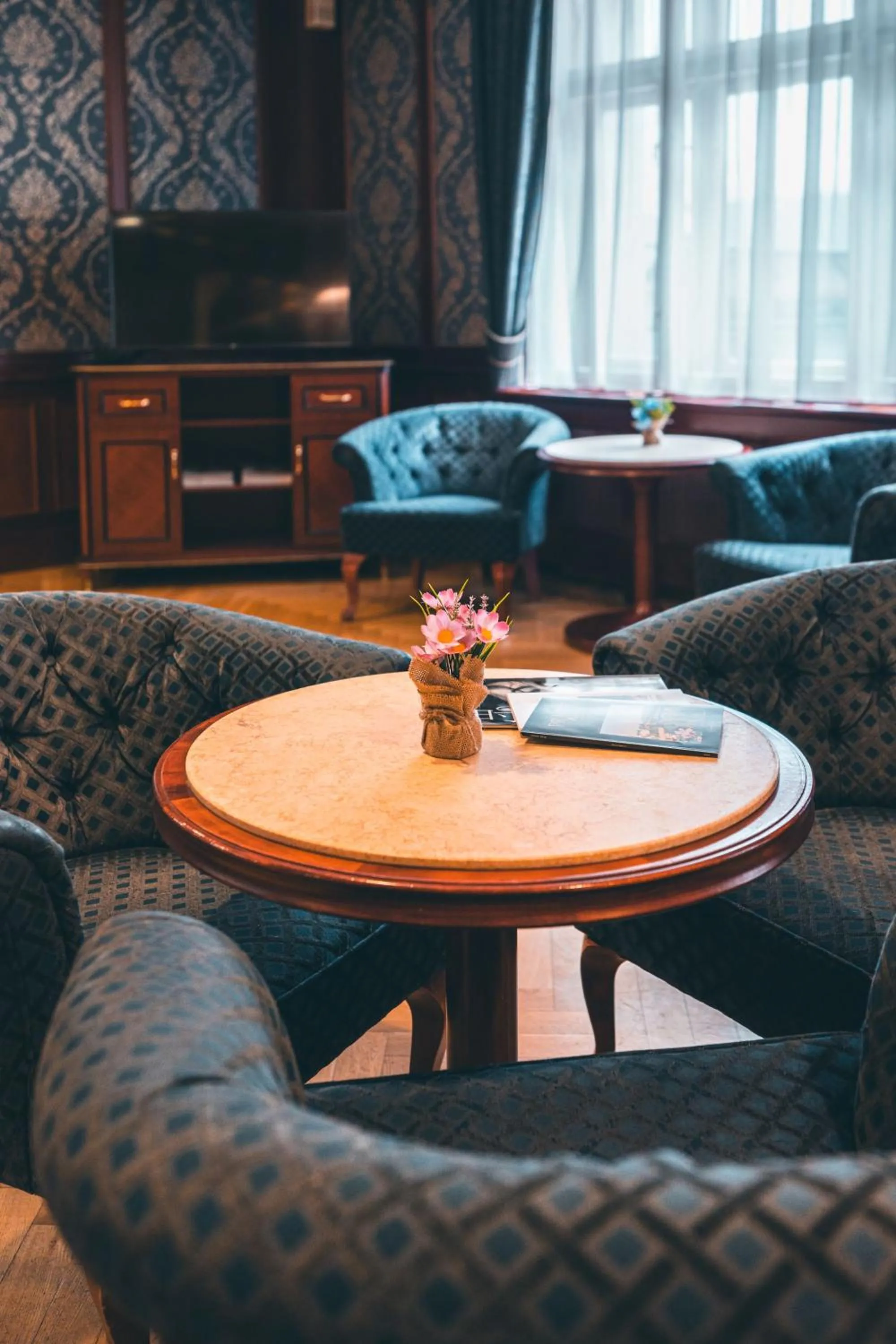 Communal lounge/ TV room in Elysee Hotel