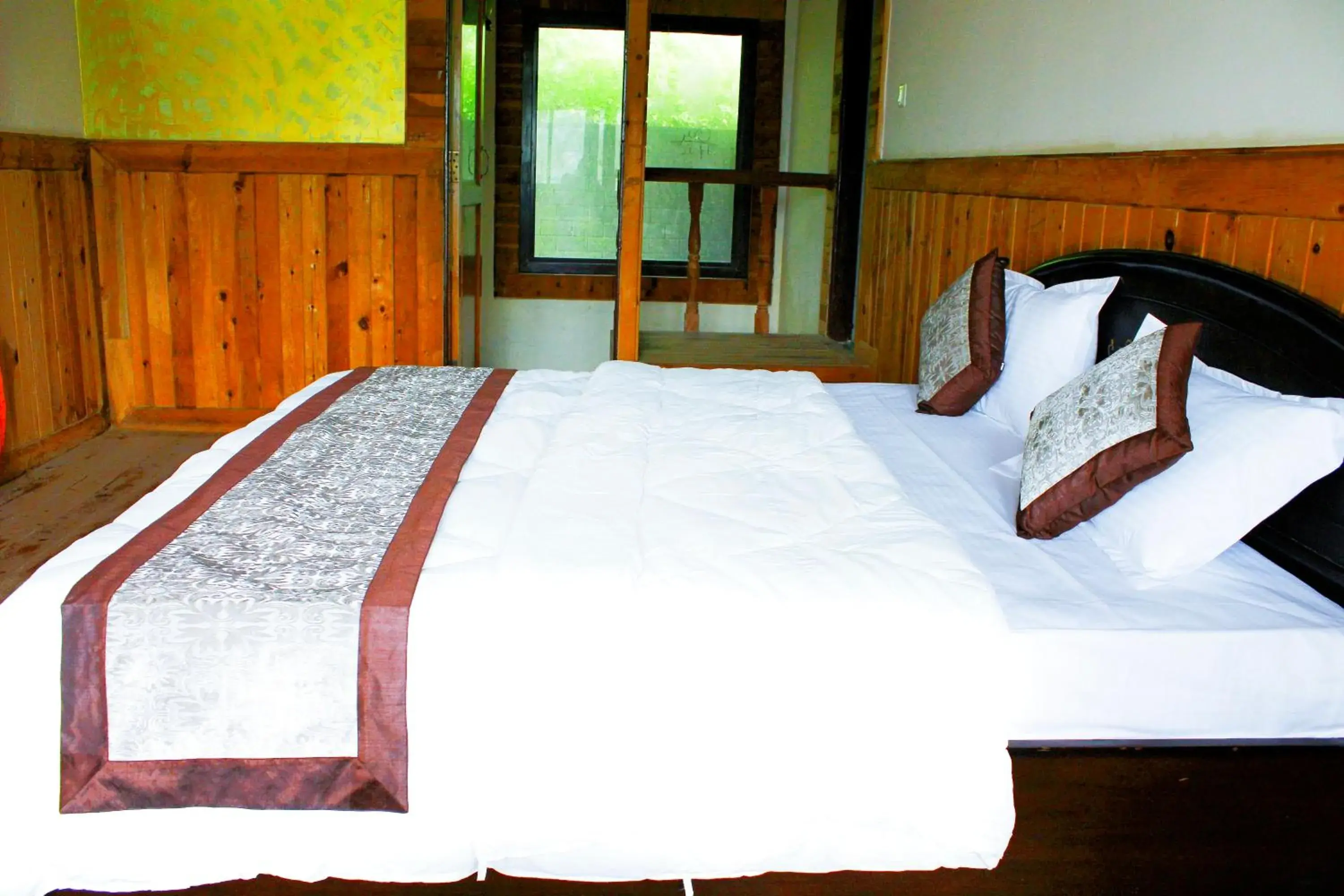 Bed in The Canadian Woods Resort Bed in The Canadian Woods Resort