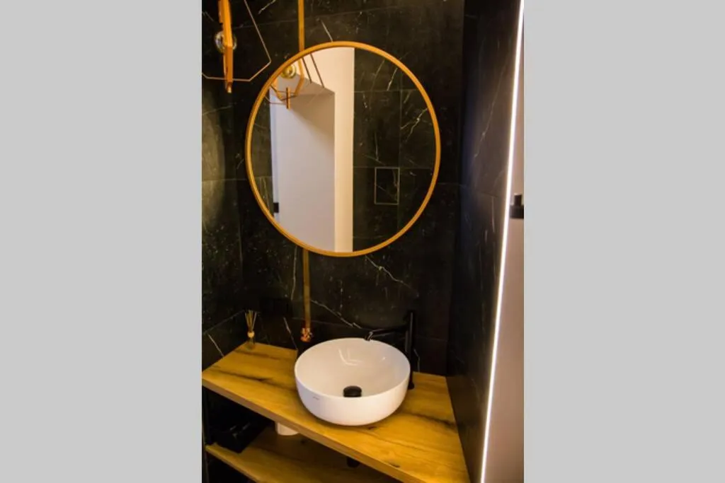 Bathroom in Miedziany by Rentoom