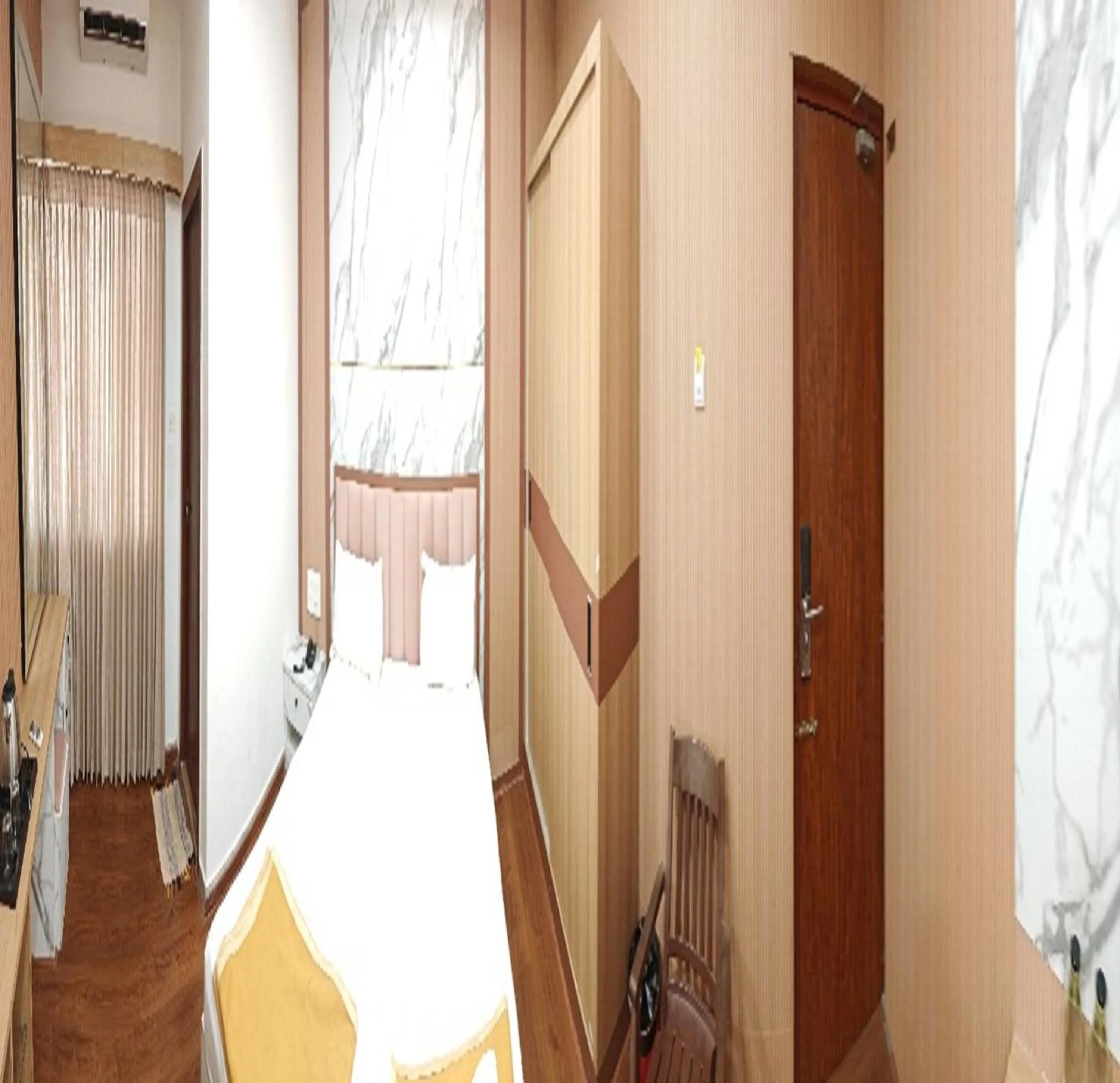 Seating area, Bed in Hotel Geetha International