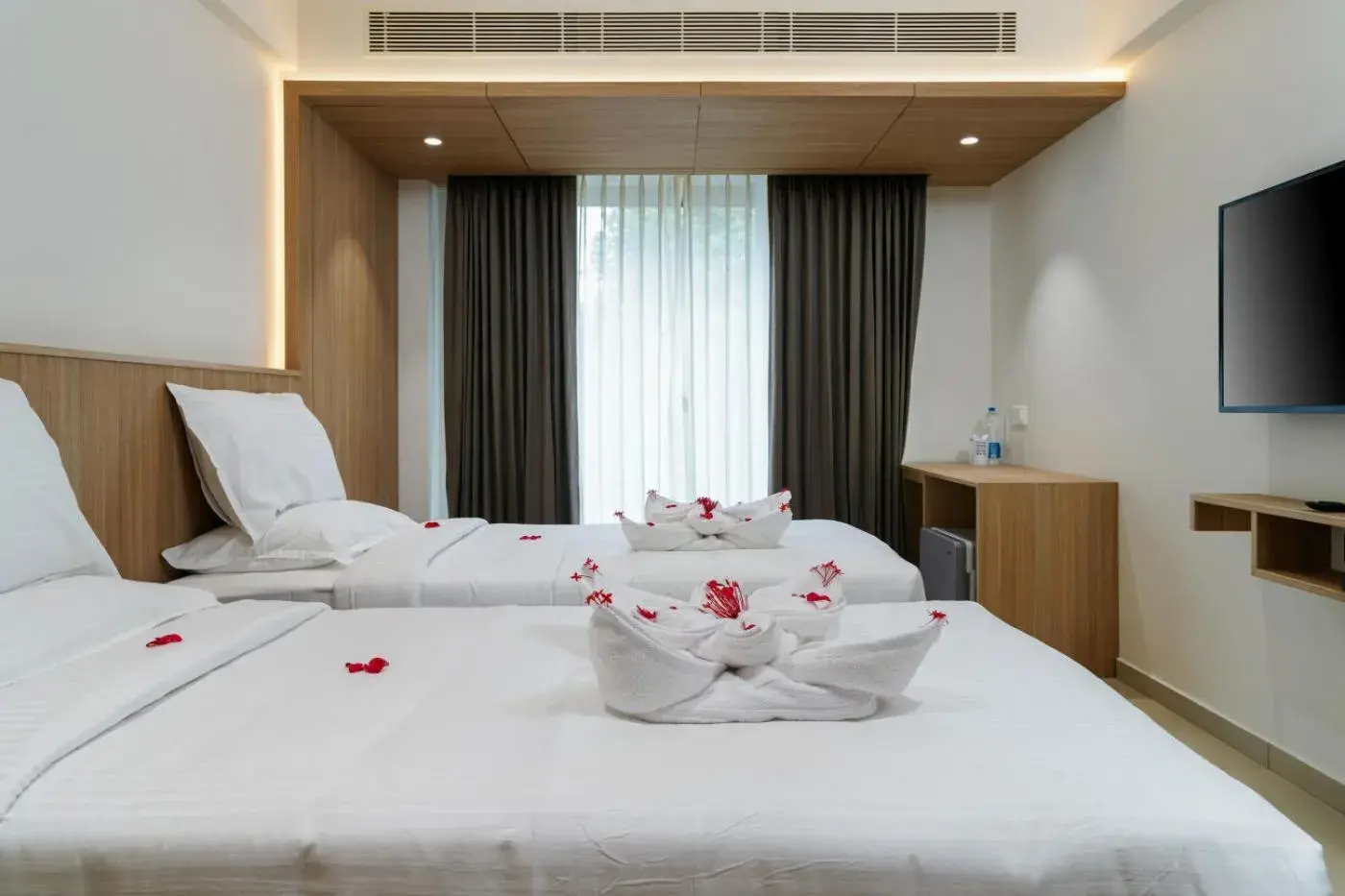 Bed in The Trios Hotel Bed in The Trios Hotel