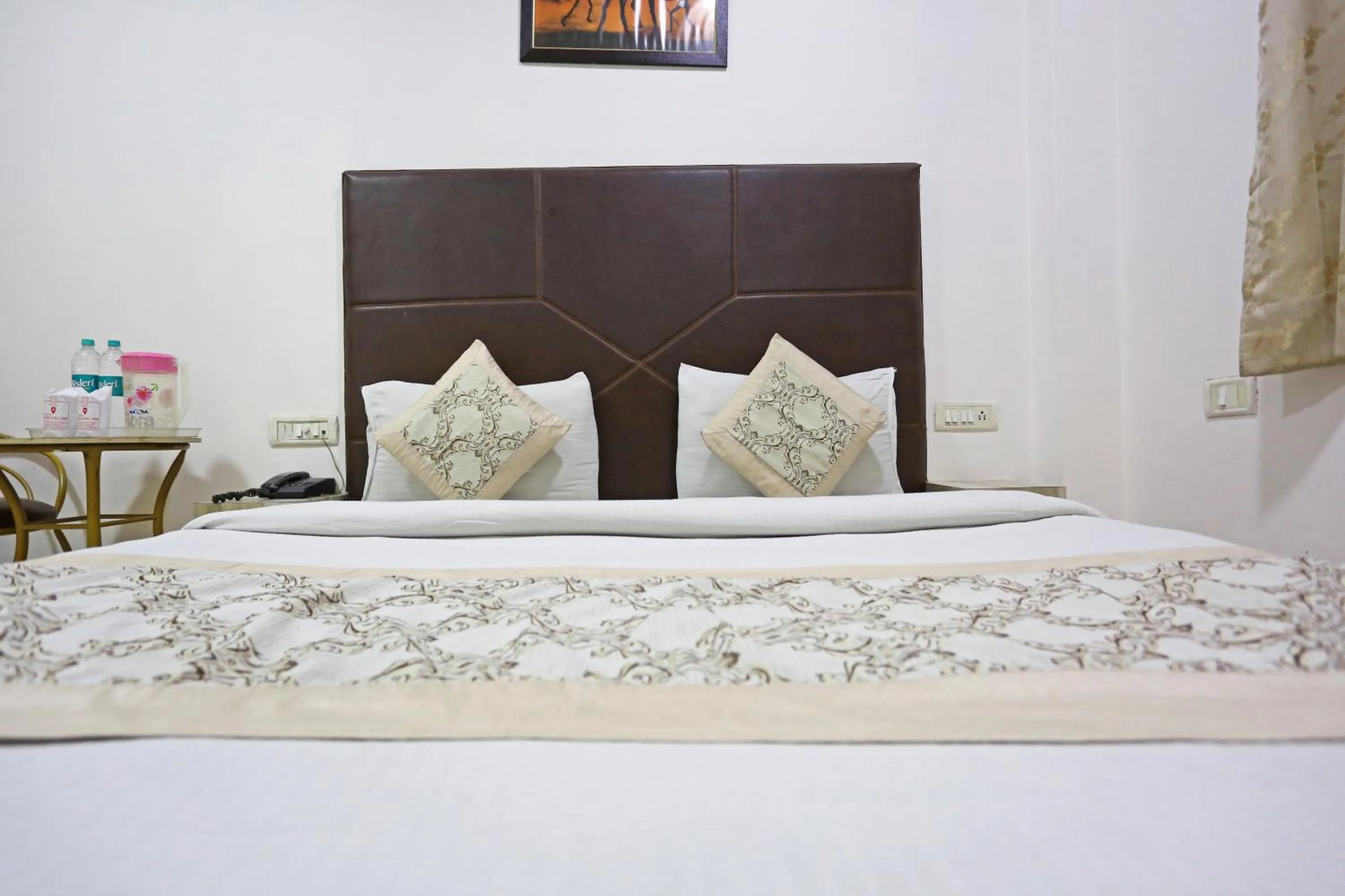 Bed in Hotel Sterling Inn, New Delhi