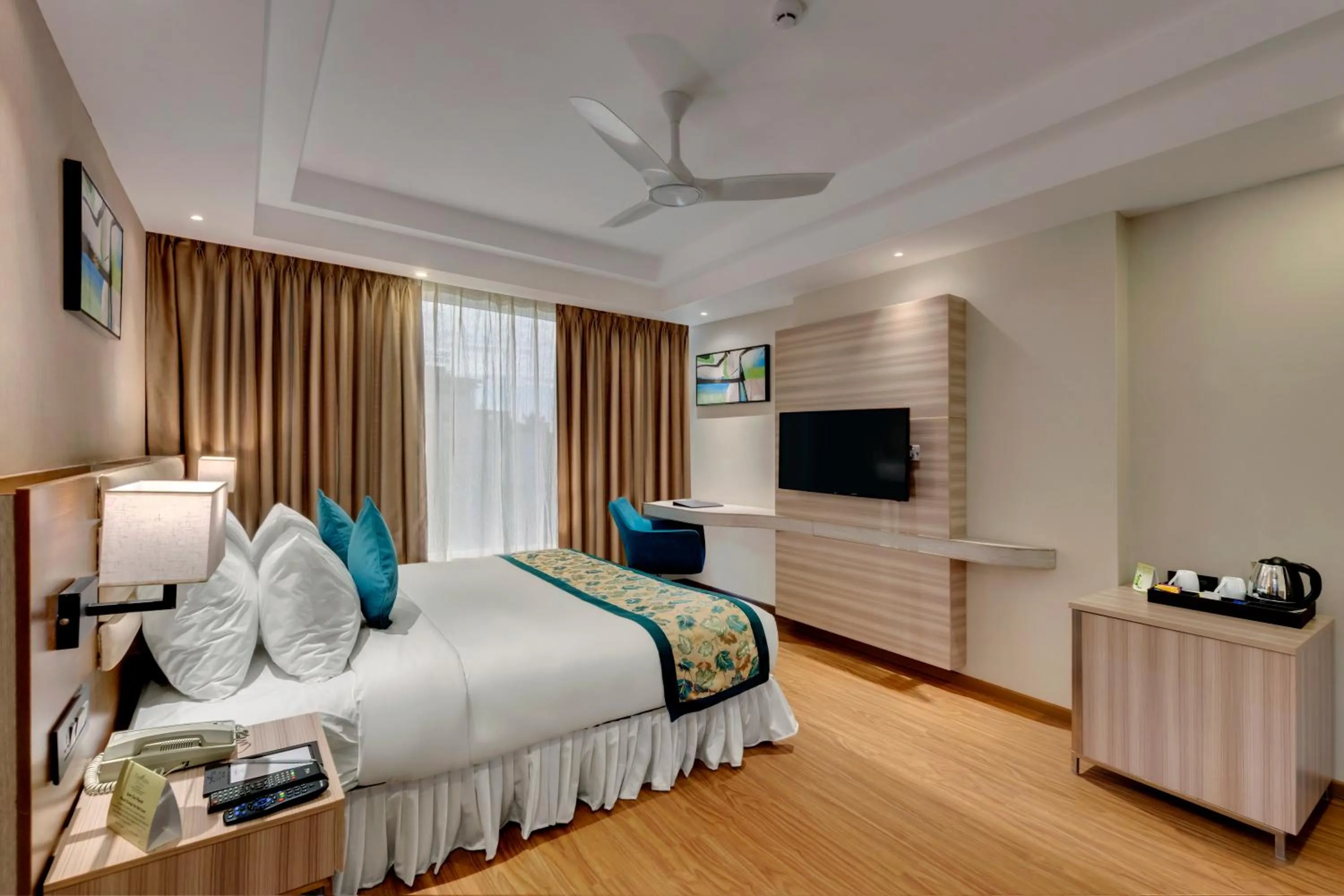 Photo of the whole room, Bed in The Fern Residency Hubballi