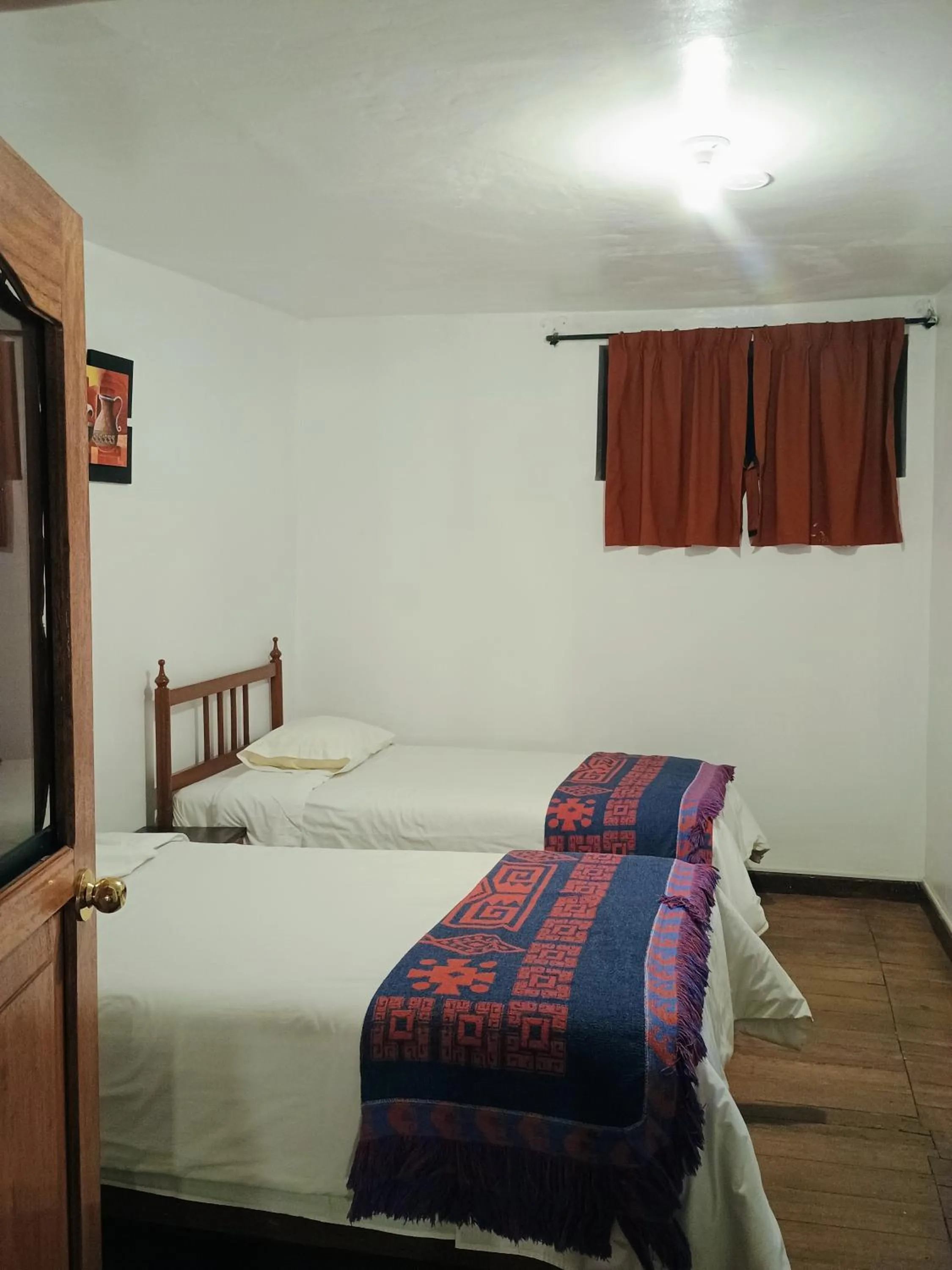 Bed in Posada Catama INN