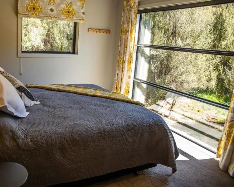 Bed in Tongariro Suites