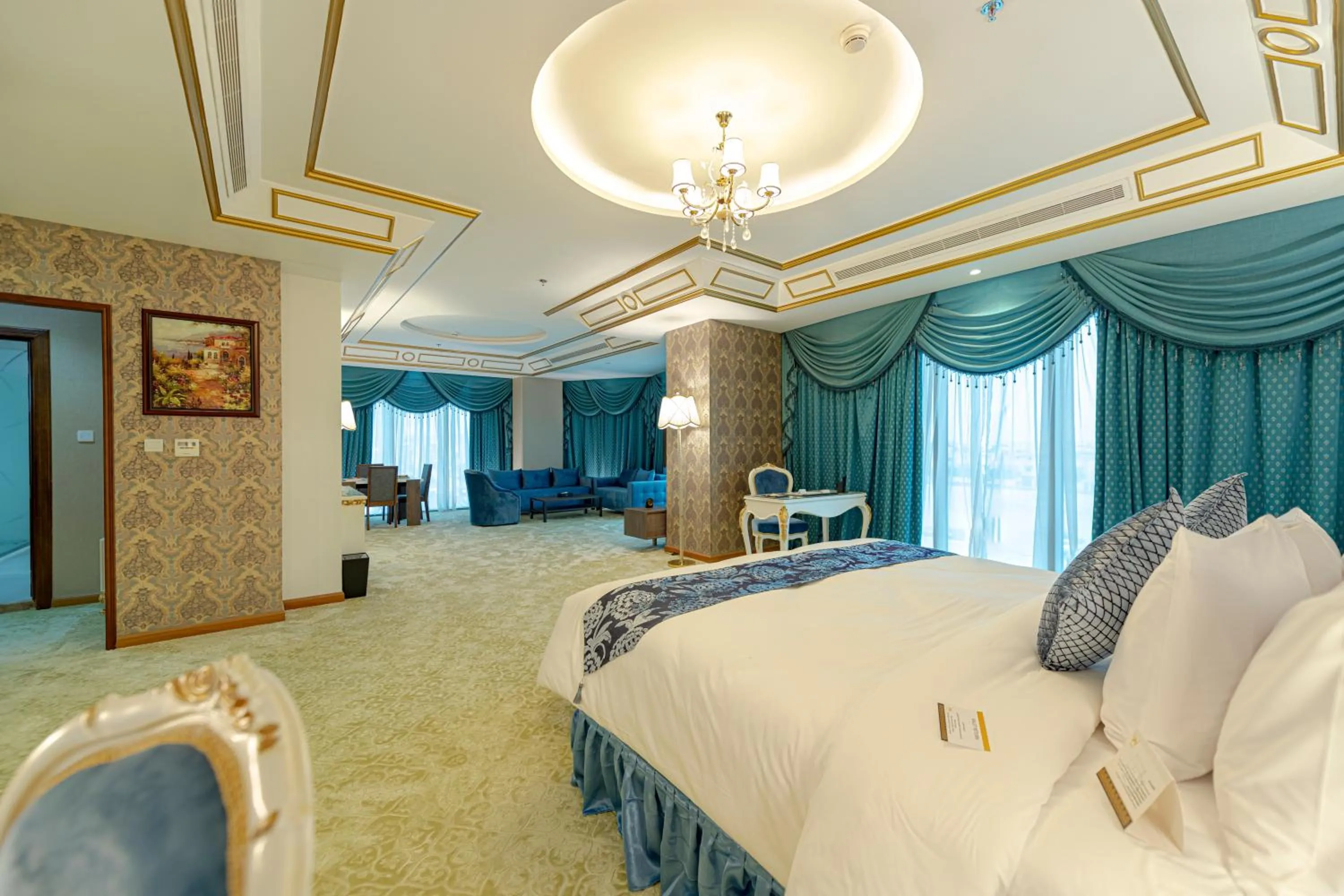 Seating area, Bed in WA Hotel