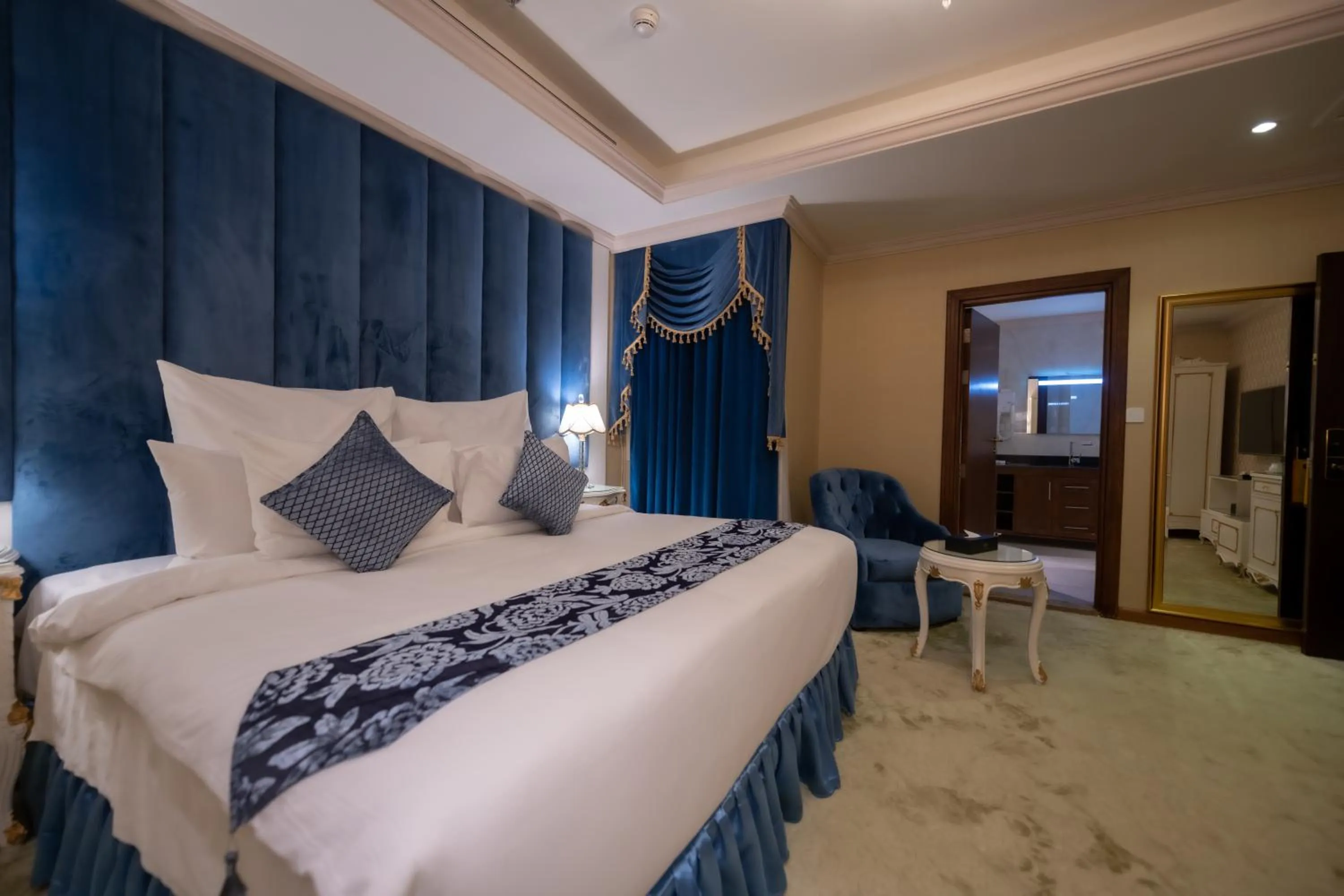 Seating area, Bed in WA Hotel