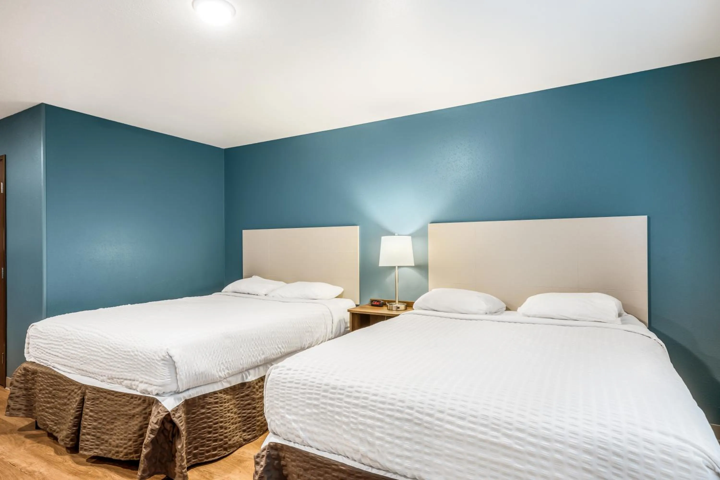 Bed in WoodSpring Suites Round Rock-Austin North